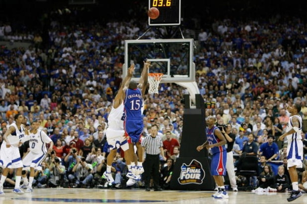 SAN ANTONIO - APRIL 07:  Mario Chalmers #15 of the Kansas Jayhawks shoots and makes a three-pointer to tie the game to send it into overtime against the Memphis Tigers during the 2008 NCAA Men's National Championship game at the Alamodome on April 7, 2008