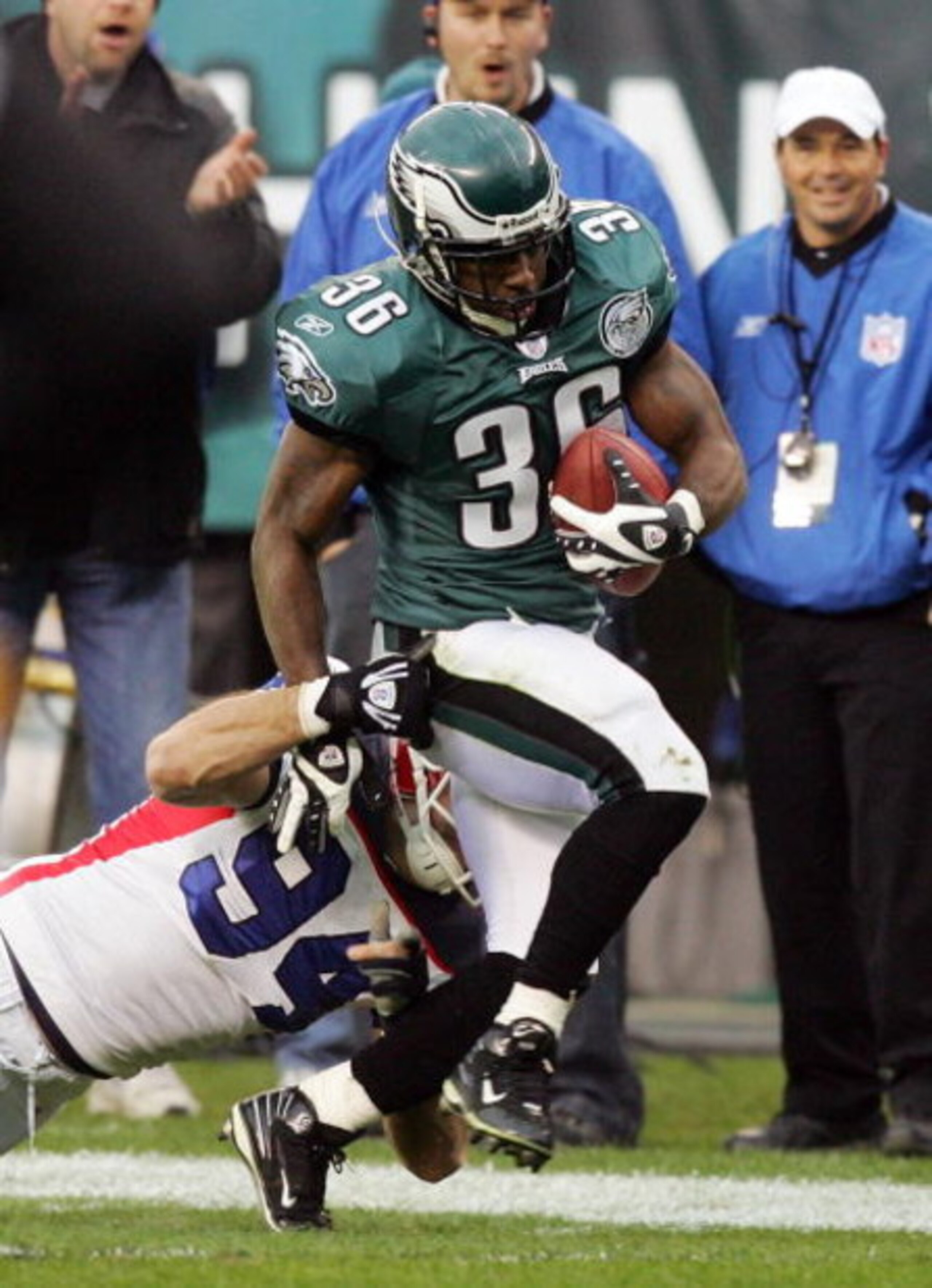 PHILADELPHIA - DECEMBER 30:  Brian Westbrook #36 of the Philadelphia Eagles runs a reception past Aaron Schobel #94 of the Buffalo Bills setting a team record with 89 catches on December 30, 2007 at Lincoln Financial Field in Philadelphia, Pennsylvania.  