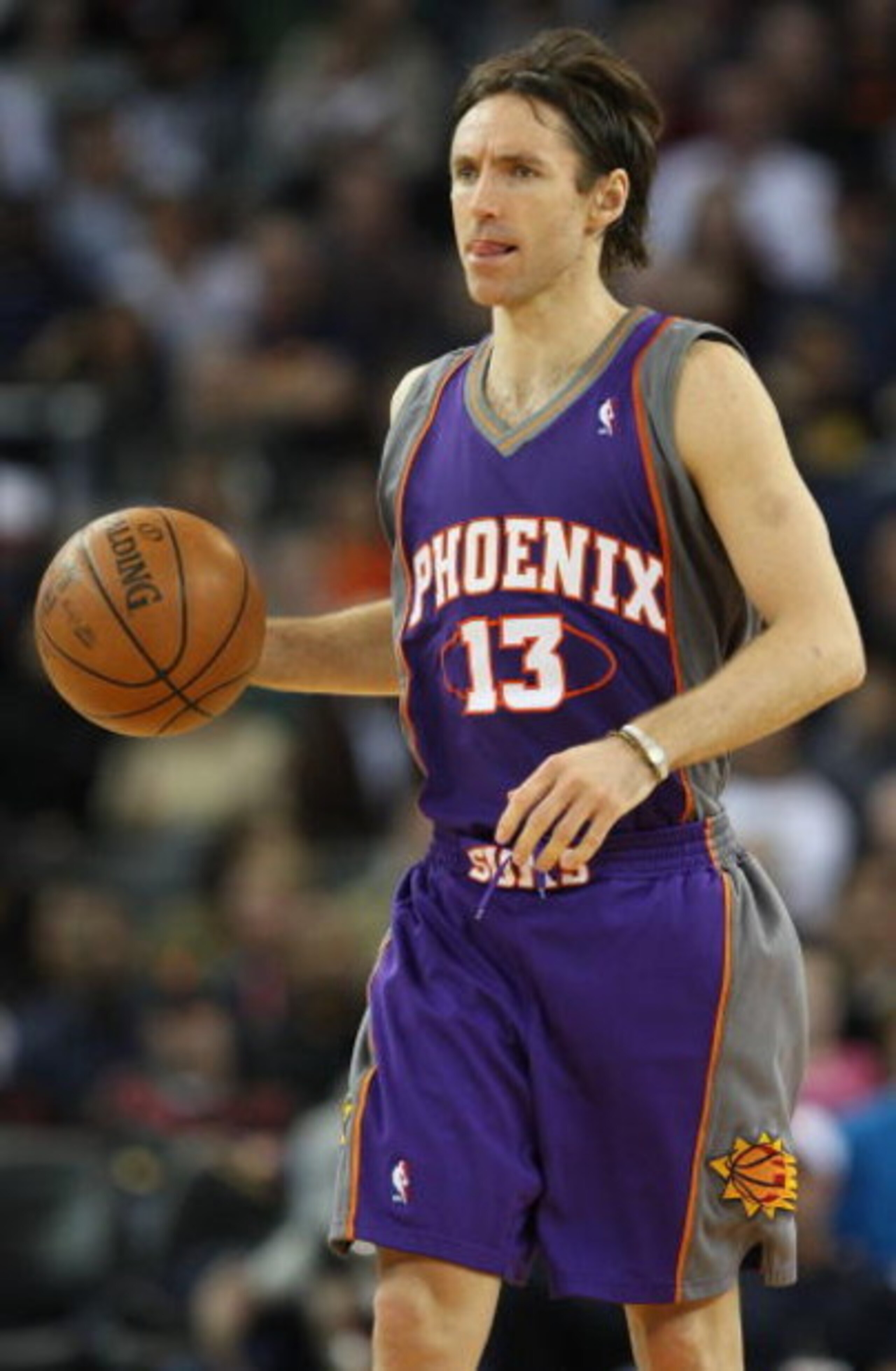 OAKLAND, CA - MARCH 15:  Steve Nash #13 of the Phoenix Suns dribbles the ball against the Golden State Warriors during an NBA game on March 15, 2009 at Oracle Arena in Oakland, California. NOTE TO USER: User expressly acknowledges and agrees that, by down