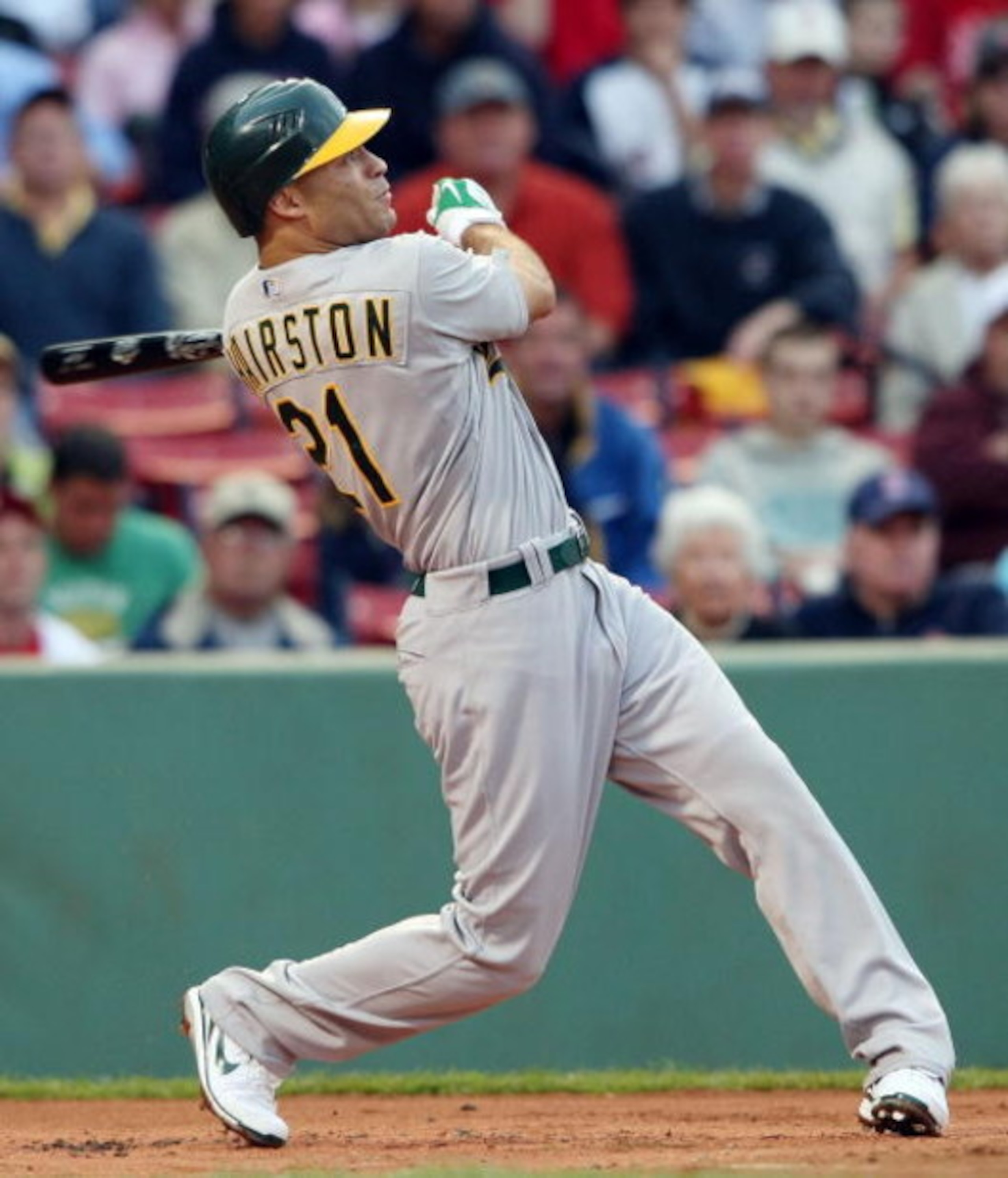 BOSTON - JULY 07:  Scott Hairston #21 of the Oakland Athletics hits a solo home run in the first inning off a pitch by Josh Beckett of the Boston Red Sox non July 7, 2009 at Fenway Park in Boston, Massachusetts.  (Photo by Elsa/Getty Images)