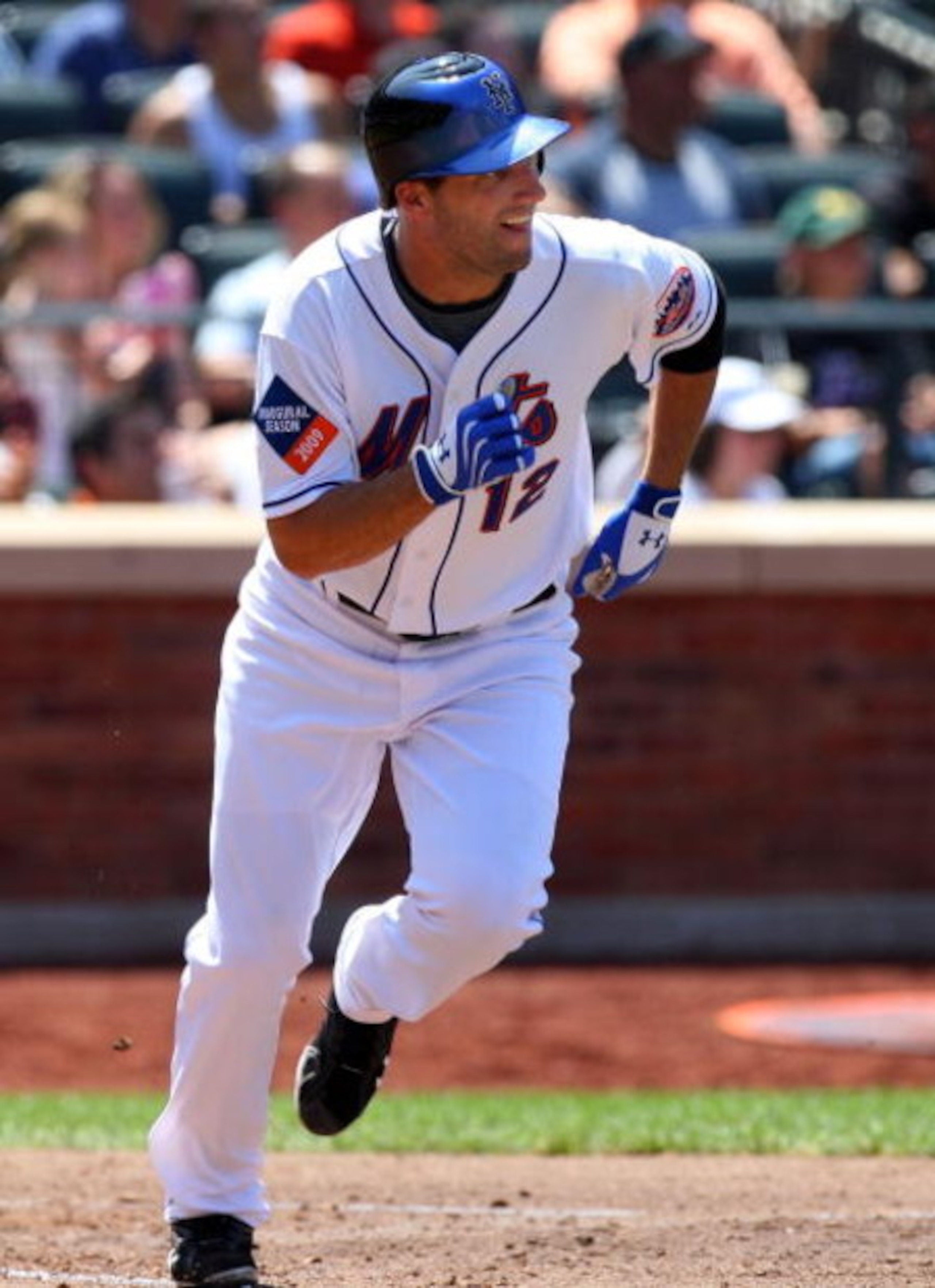 NEW YORK - JULY 12:  Jeff Francoeur #12 of the New York Mets hits a fourth inning single against the Cincinnati Reds on July 12, 2009 at Citi Field in the Flushing neighborhood of the Queens borough of New York City.  (Photo by Jim McIsaac/Getty Images)