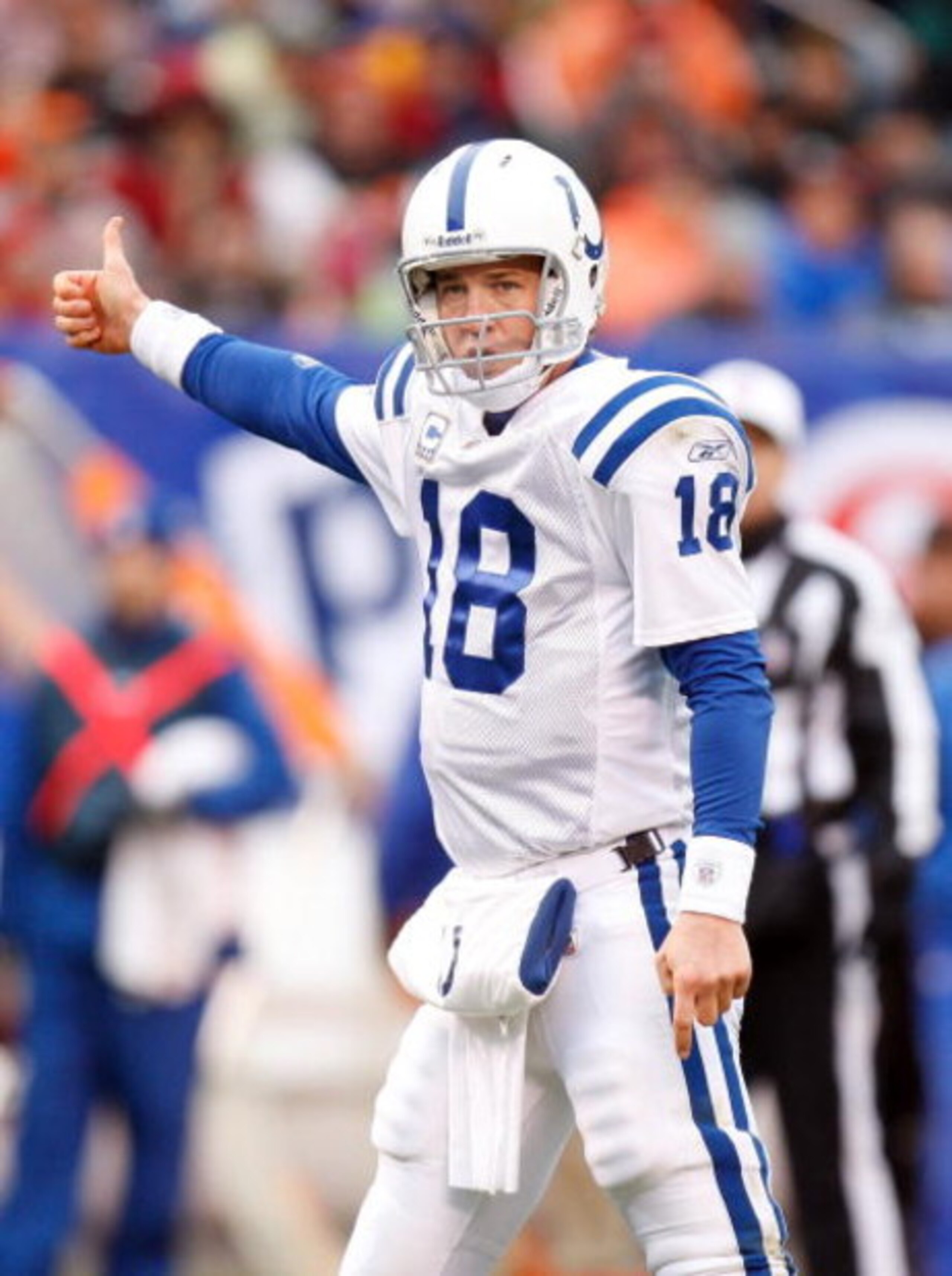 CLEVELAND - NOVEMBER 30: Quarterback Peyton Manning #18 of the Indianapolis Colts makes a hand signal during their NFL game against the Cleveland Browns on November 30, 2008 at Cleveland Browns Stadium in Cleveland, Ohio. The Colts defeated the Browns 10 CLEVELAND - NOVEMBER 30: Quarterback Peyton Manning #18 of the Indianapolis Colts makes a hand signal during their NFL game against the Cleveland Browns on November 30, 2008 at Cleveland Browns Stadium in Cleveland, Ohio. The Colts defeated the Browns 10