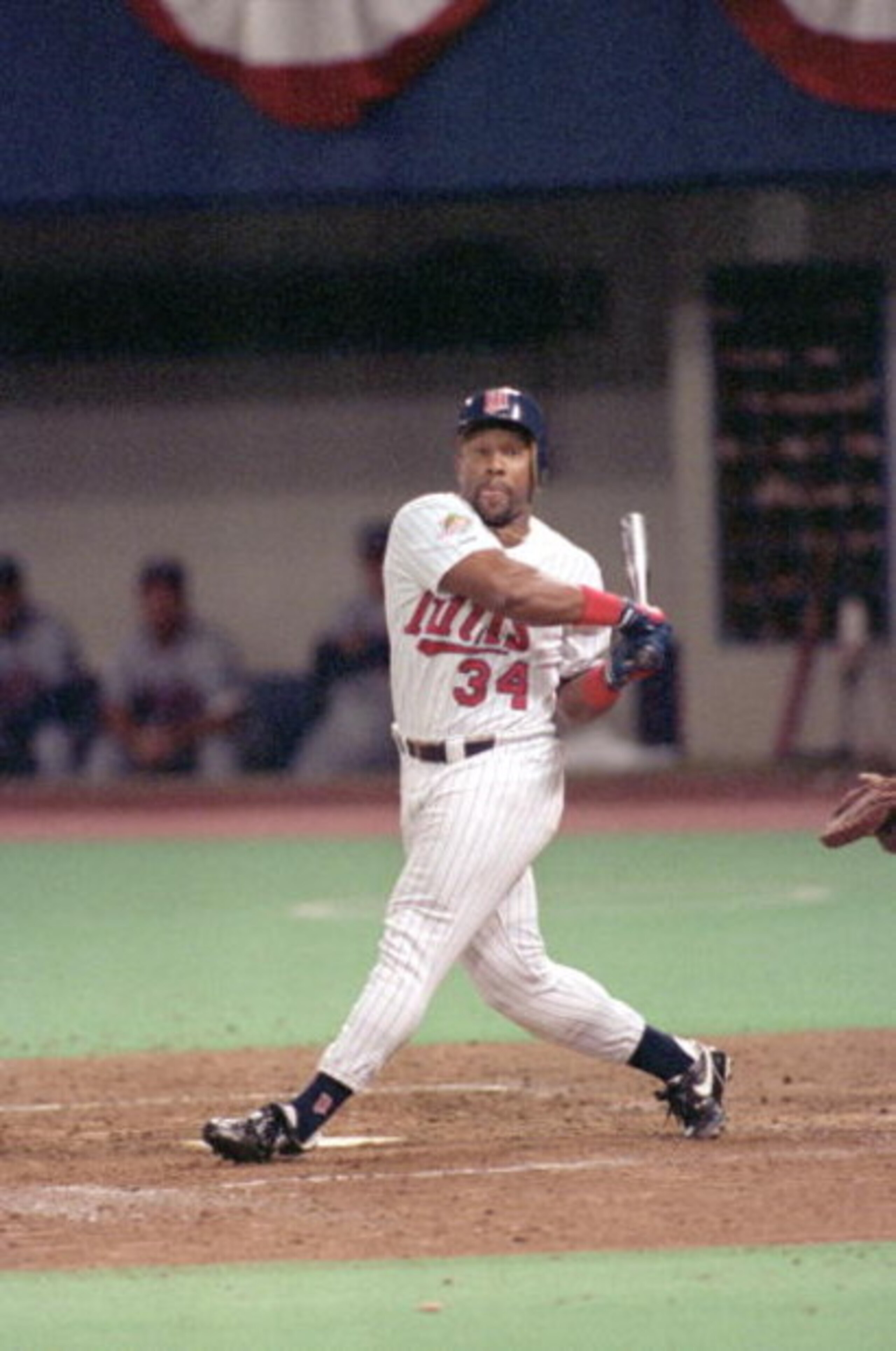 MINNEAPOLIS - OCTOBER 20:  Kirby Puckett #34 of the Minnesota Twins swings at a pitch during Game two of the 1991 World Series against the Atlanta Braves at the Metrodome on October 20, 1991 in Minneapolis, Minnesota. The Twins defeated the Braves 3-2.  (