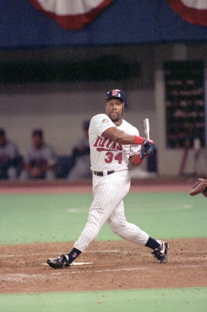 MINNEAPOLIS - OCTOBER 20:  Kirby Puckett #34 of the Minnesota Twins swings at a pitch during Game two of the 1991 World Series against the Atlanta Braves at the Metrodome on October 20, 1991 in Minneapolis, Minnesota. The Twins defeated the Braves 3-2.  (