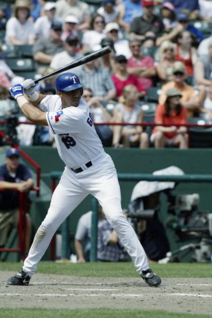 ARLINGTON, TX - MAY 11:  Juan Gonzalez #19 of the Texas Rangers stands at bat during the game against the Cleveland Indians at the Ballpark in Arlington on May 11, 2003 in Arlington, Texas.  The Rangers defeated the Indians 17-10.  (Photo by Ronald Martin