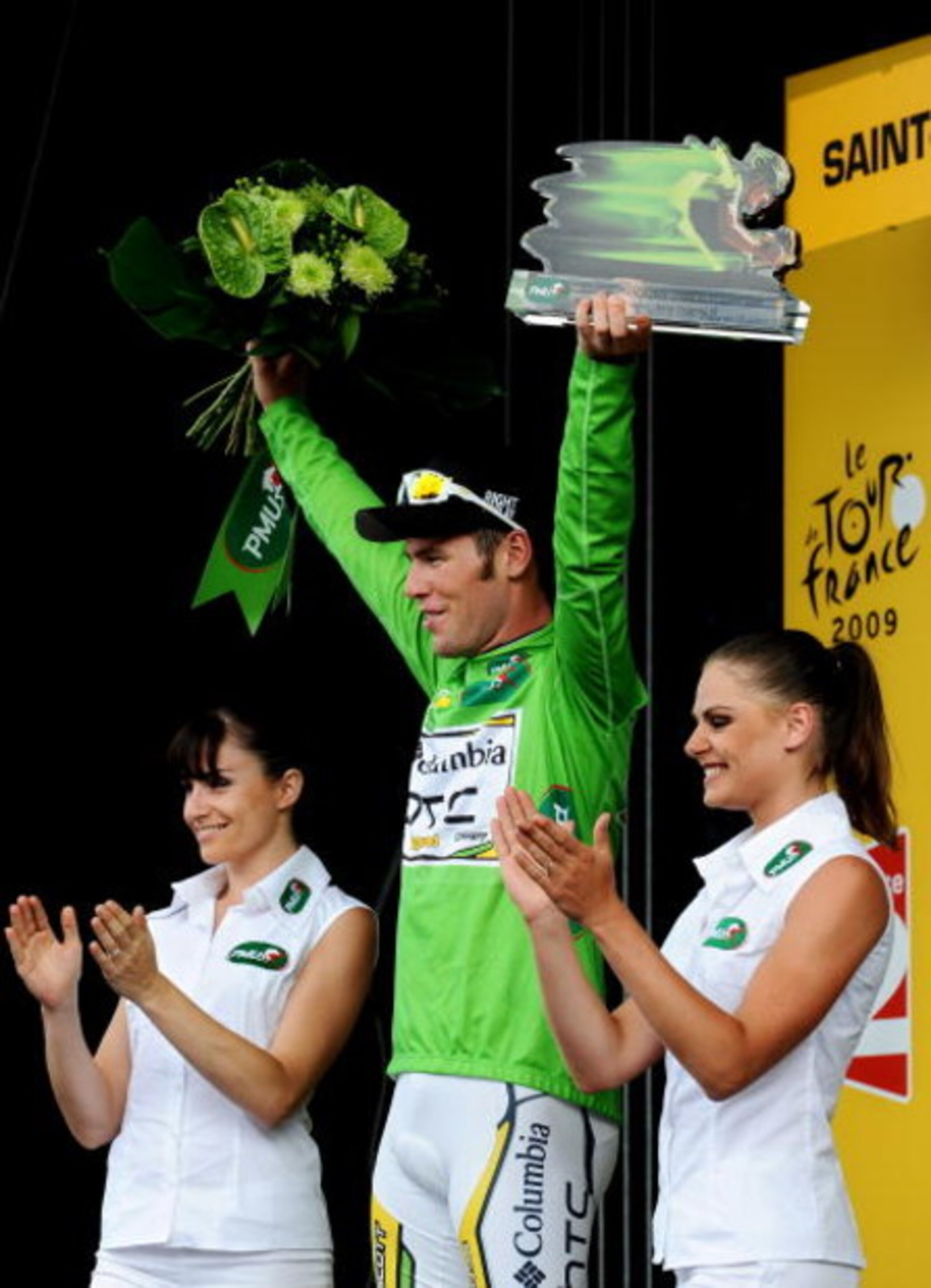 SAINT-FARGEAU-PONTHIERRY, FRANCE - JULY 15:  Stage winner Mark Cavendish of Great Britain and Team Columbia HTC celebrates in the green jersey on the podium after winning stage 11 of the 2009 Tour de France from Vatan to Saint-Fargeau-Ponthierry on July 1