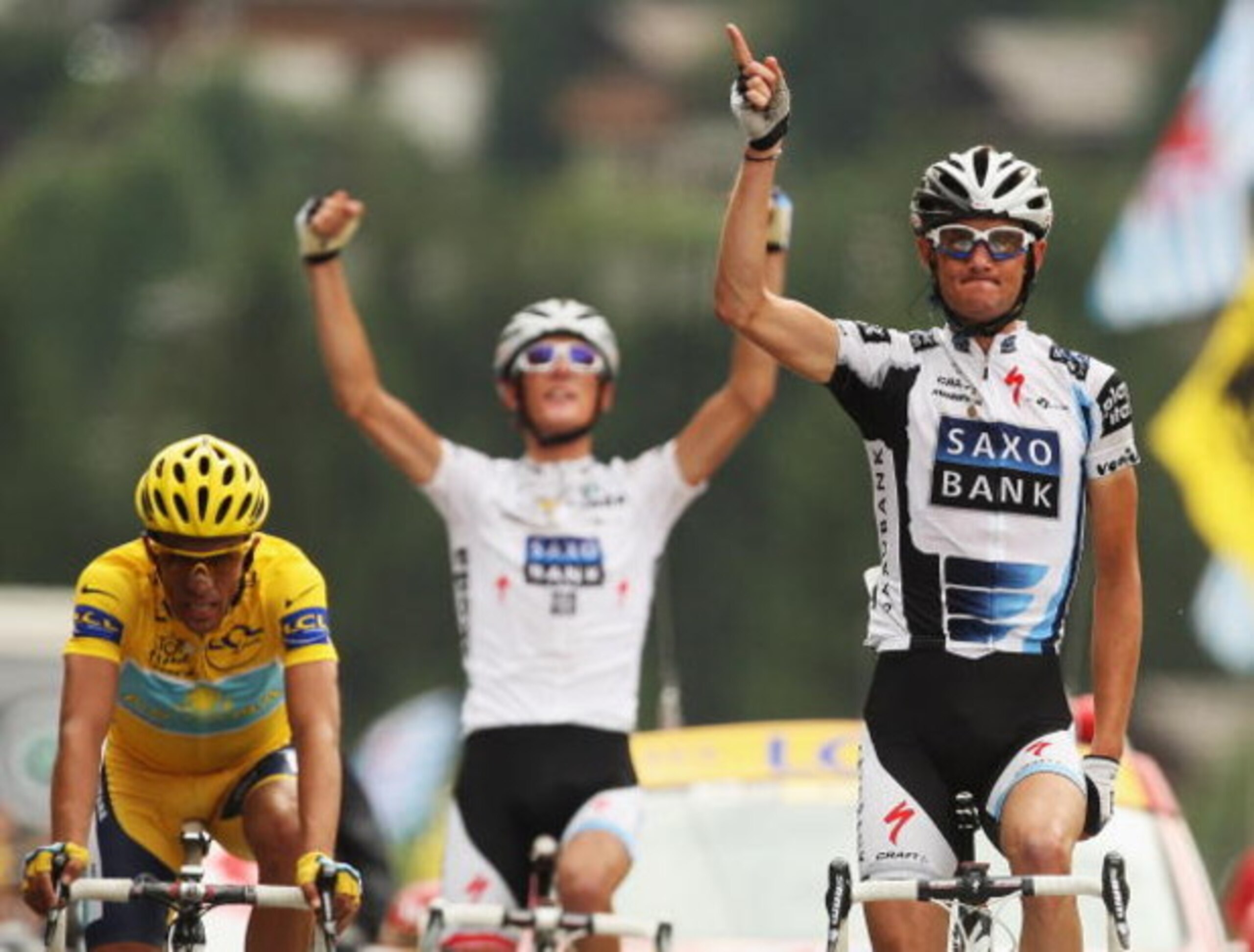 LE GRAND BORNAND, FRANCE - JULY 22:  Frank Schleck of Luxembourg and Saxo Bank crosses the finish line in front of Alberto Contador and Andy Schleck to win stage 17 of the 2009 Tour de France from Bourg-Saint-Maurice to Le Grand Bornand on July 22, 2009 i