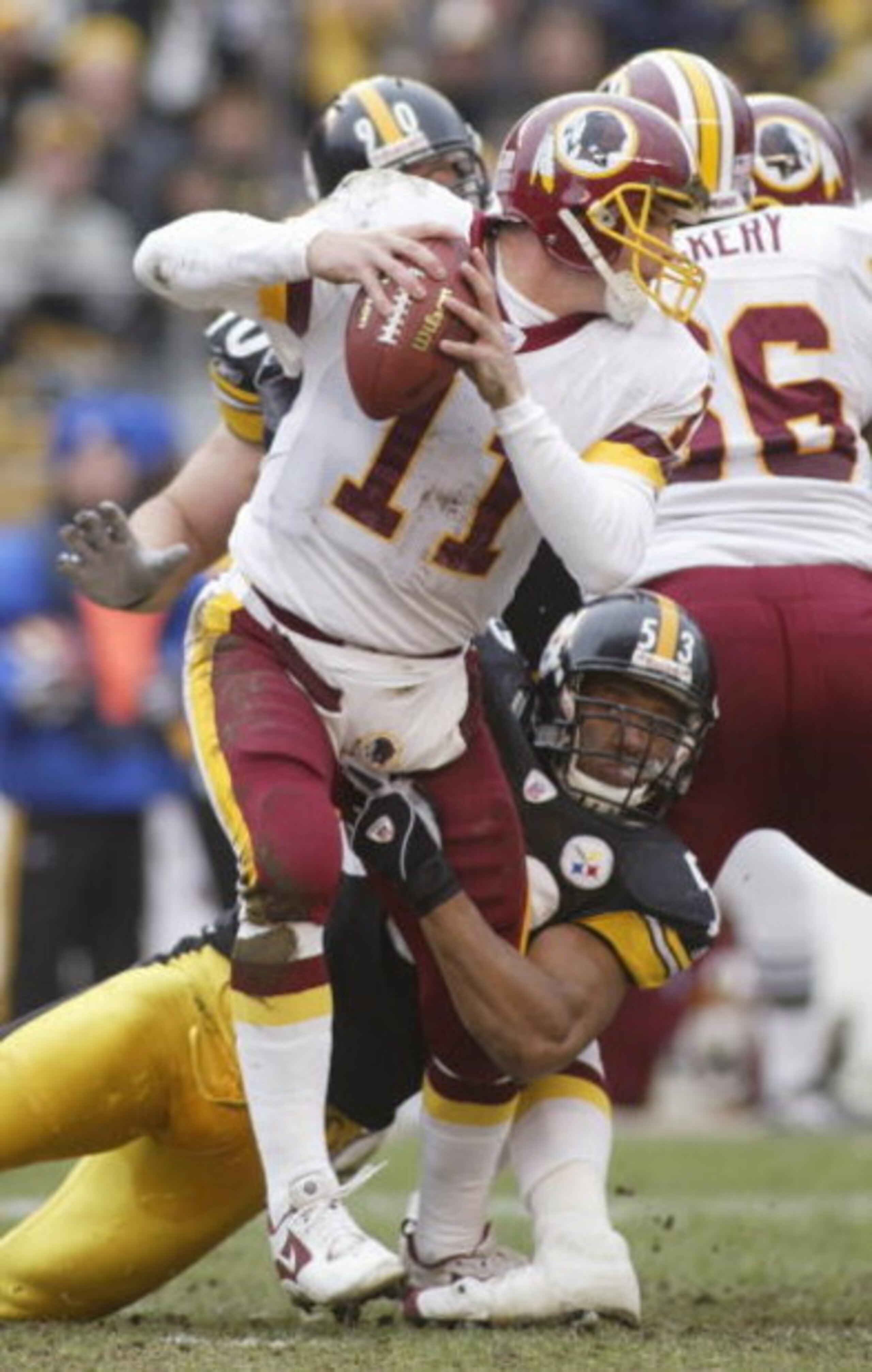 PITTSBURGH - NOVEMBER 28:  Quaterback Patrick Ramsey #11 of the Washington Redskins is sacked by outside linebacker Clark Haggans #53 of the Pittsburgh Steelers during the game on November 28, 2004 at Heinz Field in Pittsburgh, Pennsylvania. The Steelers 