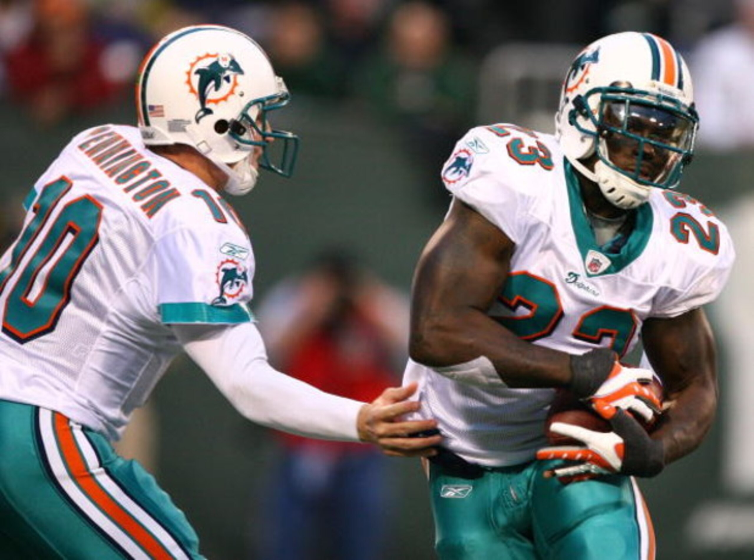 EAST RUTHERFORD, NJ - DECEMBER 28: Chad Pennington #10 of The Miami Dolphins hands the ball off to Ronnie Brown #23 against the New York Jets during their game on December 28, 2008 at Giants Stadium in East Rutherford, New Jersey. (Photo by Al Bello/Get EAST RUTHERFORD, NJ - DECEMBER 28: Chad Pennington #10 of The Miami Dolphins hands the ball off to Ronnie Brown #23 against the New York Jets during their game on December 28, 2008 at Giants Stadium in East Rutherford, New Jersey. (Photo by Al Bello/Get