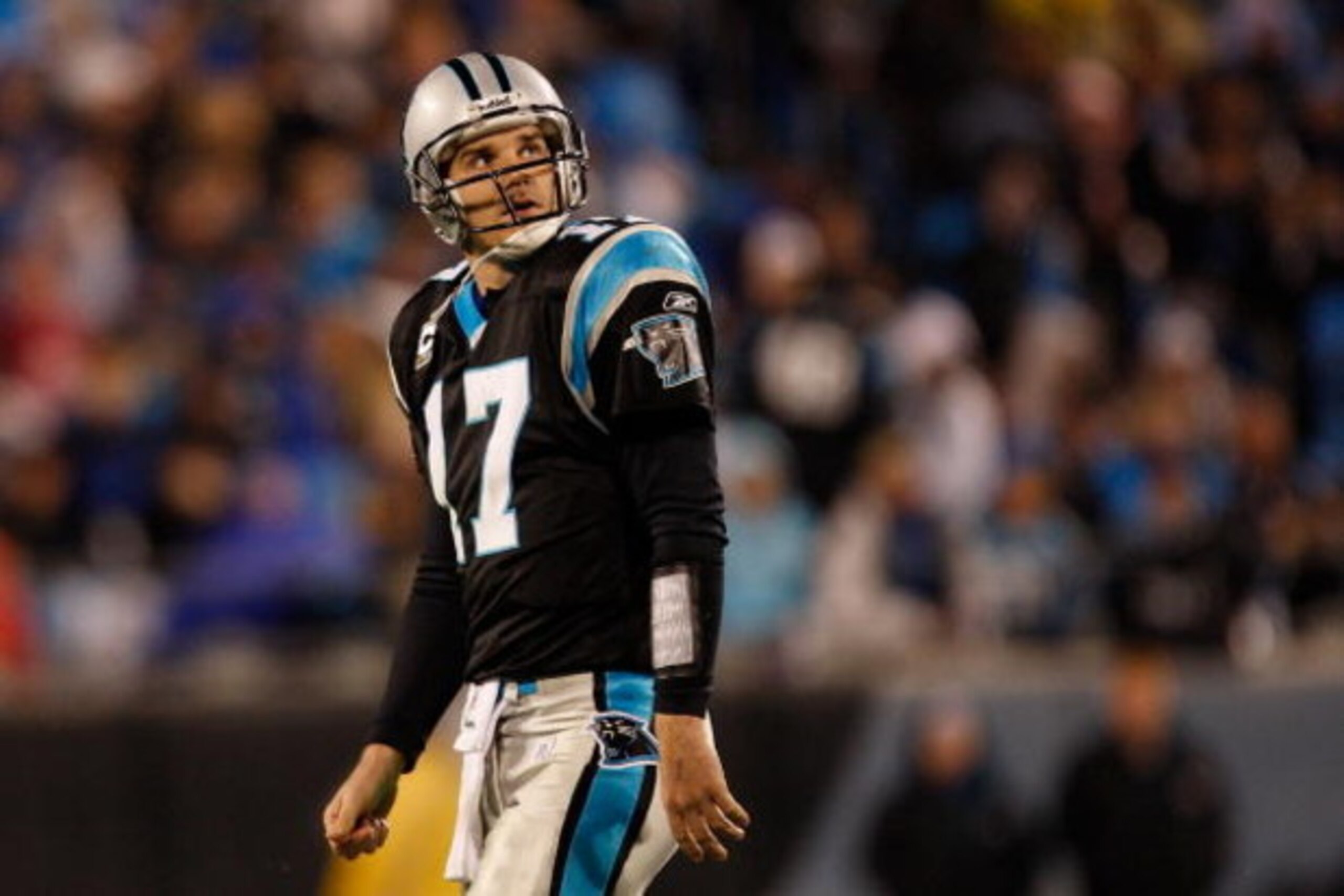 CHARLOTTE, NC - JANUARY 10: Quarterback Jake Delhomme #17 of the Carolina Panthers looks on during the game against the Arizona Cardinals during the NFC Divisional Playoff Game on January 10, 2009 at Bank of America Stadium in Charlotte, North Carolina. CHARLOTTE, NC - JANUARY 10: Quarterback Jake Delhomme #17 of the Carolina Panthers looks on during the game against the Arizona Cardinals during the NFC Divisional Playoff Game on January 10, 2009 at Bank of America Stadium in Charlotte, North Carolina.