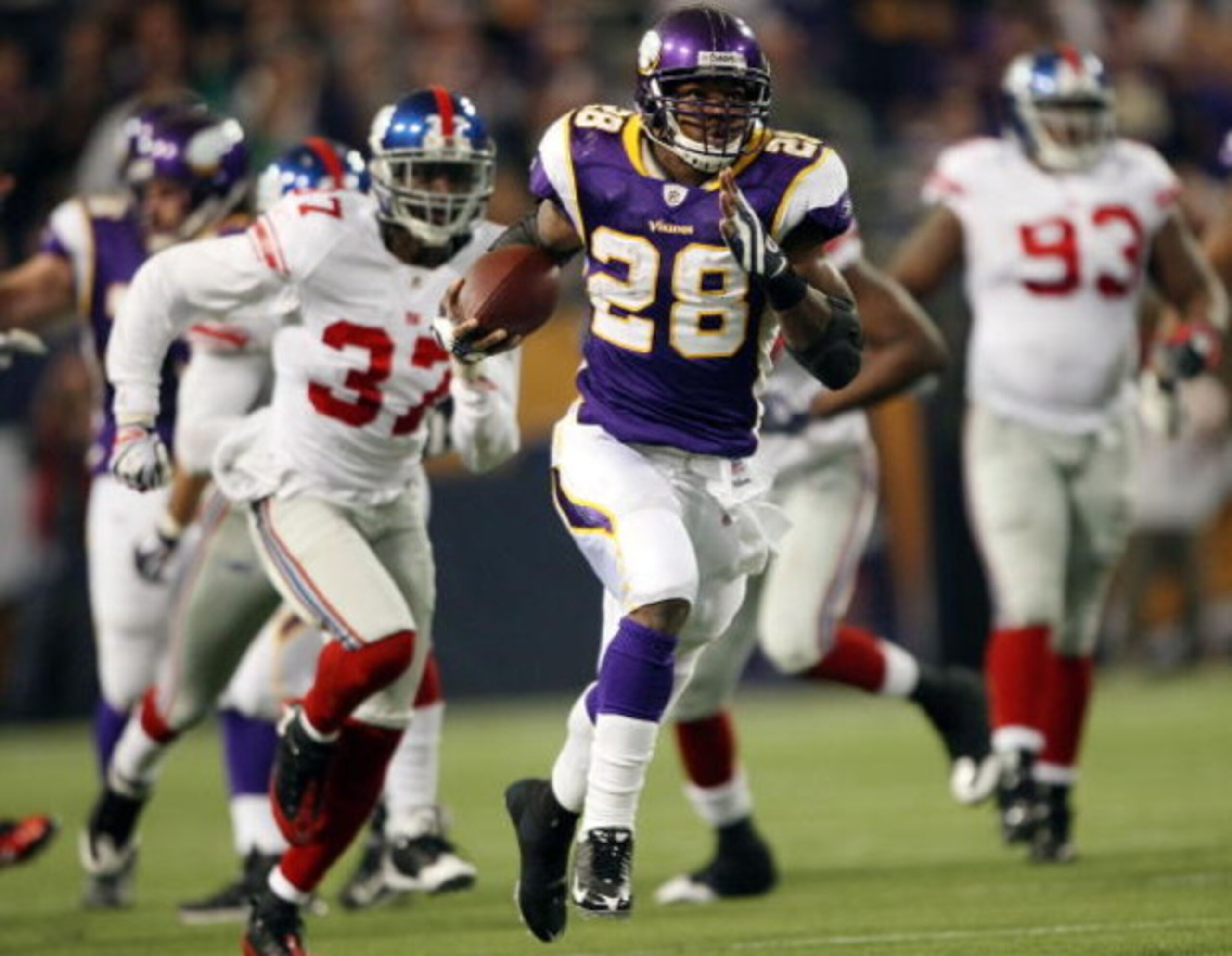 MINNEAPOLIS - DECEMBER 28: Adrian Peterson #28 of the Minnesota Vikings runs the ball in for a touchdown as James Butler of the New York Giants defends on December 28, 2008 at the Hubert H. Humphrey Metrodome in Minneapolis, Minnesota. The Vikings defea MINNEAPOLIS - DECEMBER 28: Adrian Peterson #28 of the Minnesota Vikings runs the ball in for a touchdown as James Butler of the New York Giants defends on December 28, 2008 at the Hubert H. Humphrey Metrodome in Minneapolis, Minnesota. The Vikings defea
