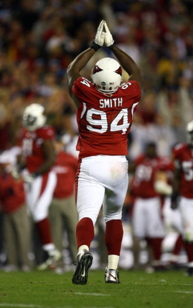 TAMPA, FL - FEBRUARY 01: Antonio Smith #94 of the Arizona Cardinals signals for a safety after Justin Hartwig #62 of the Pittsburgh Steelers was called for holding in the endzone which resulted in the endzone during the fourth quarter of Super Bowl XLIII TAMPA, FL - FEBRUARY 01: Antonio Smith #94 of the Arizona Cardinals signals for a safety after Justin Hartwig #62 of the Pittsburgh Steelers was called for holding in the endzone which resulted in the endzone during the fourth quarter of Super Bowl XLIII