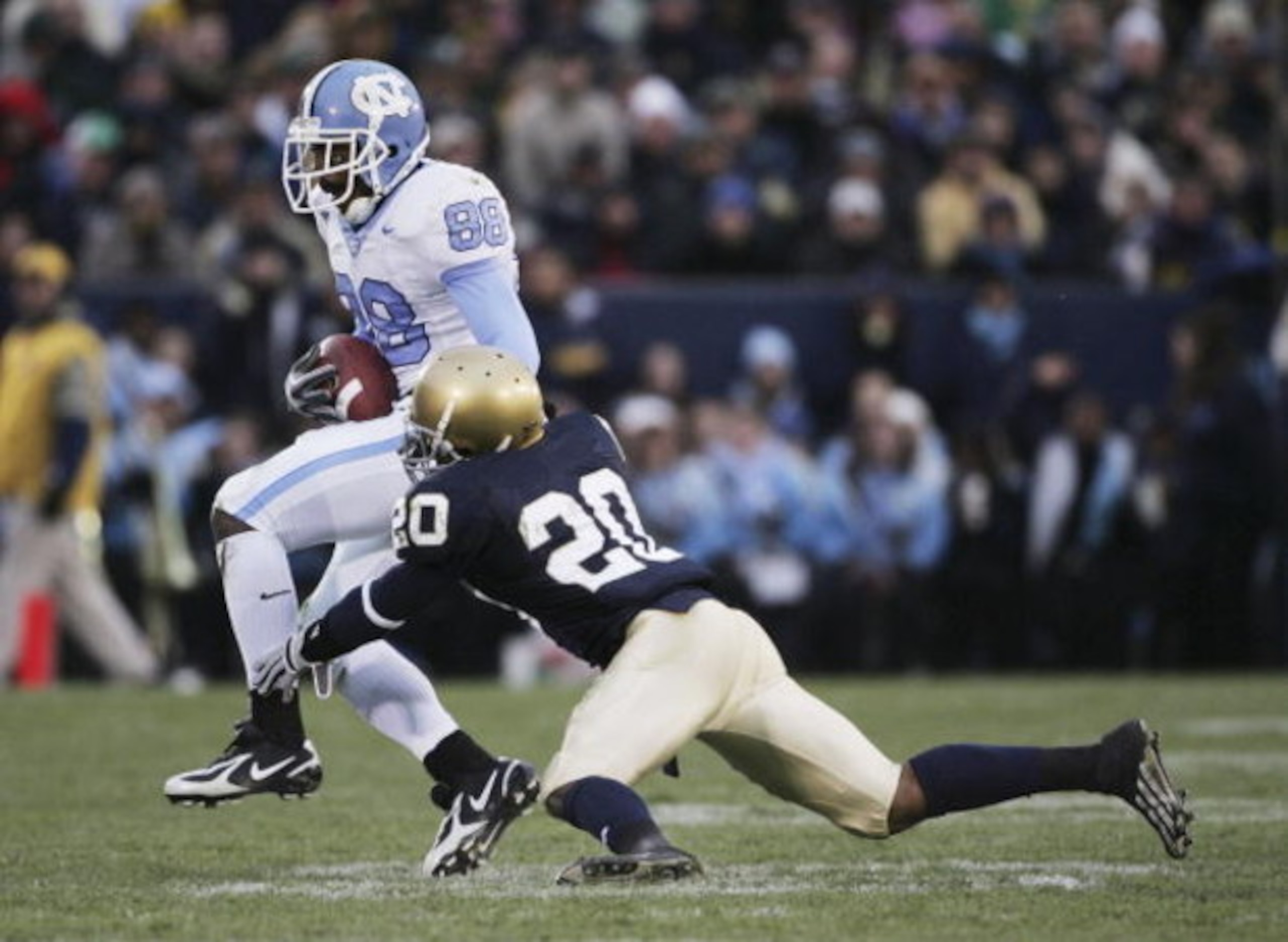 SOUTH BEND, IN - NOVEMBER 04: Hakeem Nicks #88 of the North Carolina Tar Heels breaks away from Terrail Lambert #20 of the Notre Dame Fighting Irish on his way to a 70 yard touchdown on November 4, 2006 at Notre Dame Stadium in South Bend, Indiana. (Phot SOUTH BEND, IN - NOVEMBER 04: Hakeem Nicks #88 of the North Carolina Tar Heels breaks away from Terrail Lambert #20 of the Notre Dame Fighting Irish on his way to a 70 yard touchdown on November 4, 2006 at Notre Dame Stadium in South Bend, Indiana. (Phot