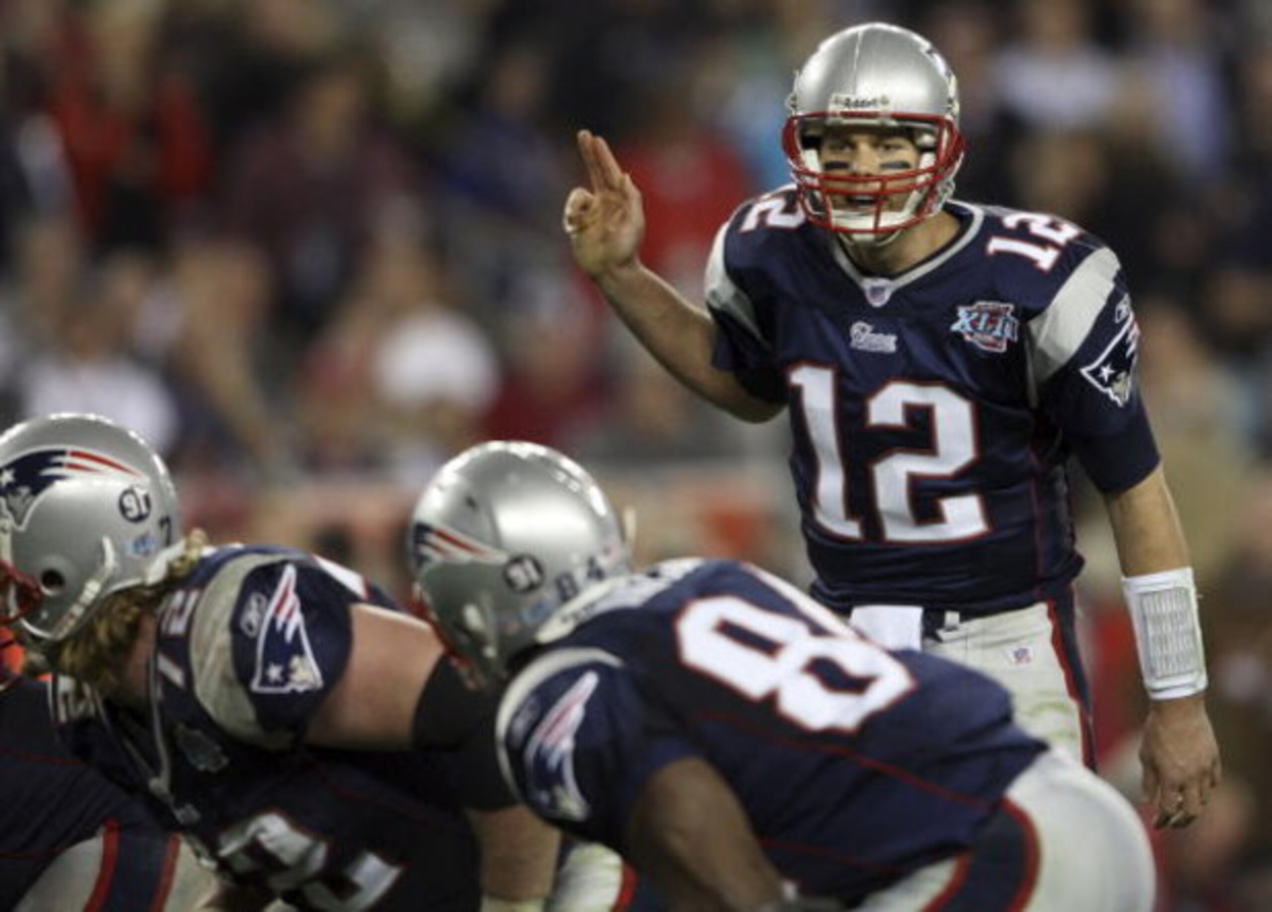 GLENDALE, AZ - FEBRUARY 03: Tom Brady #12 of of the New England Patriots calls out from under center in the fourth quarter of Super Bowl XLII against the New York Giants on February 3, 2008 at the University of Phoenix Stadium in Glendale, Arizona. (Pho GLENDALE, AZ - FEBRUARY 03: Tom Brady #12 of of the New England Patriots calls out from under center in the fourth quarter of Super Bowl XLII against the New York Giants on February 3, 2008 at the University of Phoenix Stadium in Glendale, Arizona. (Pho