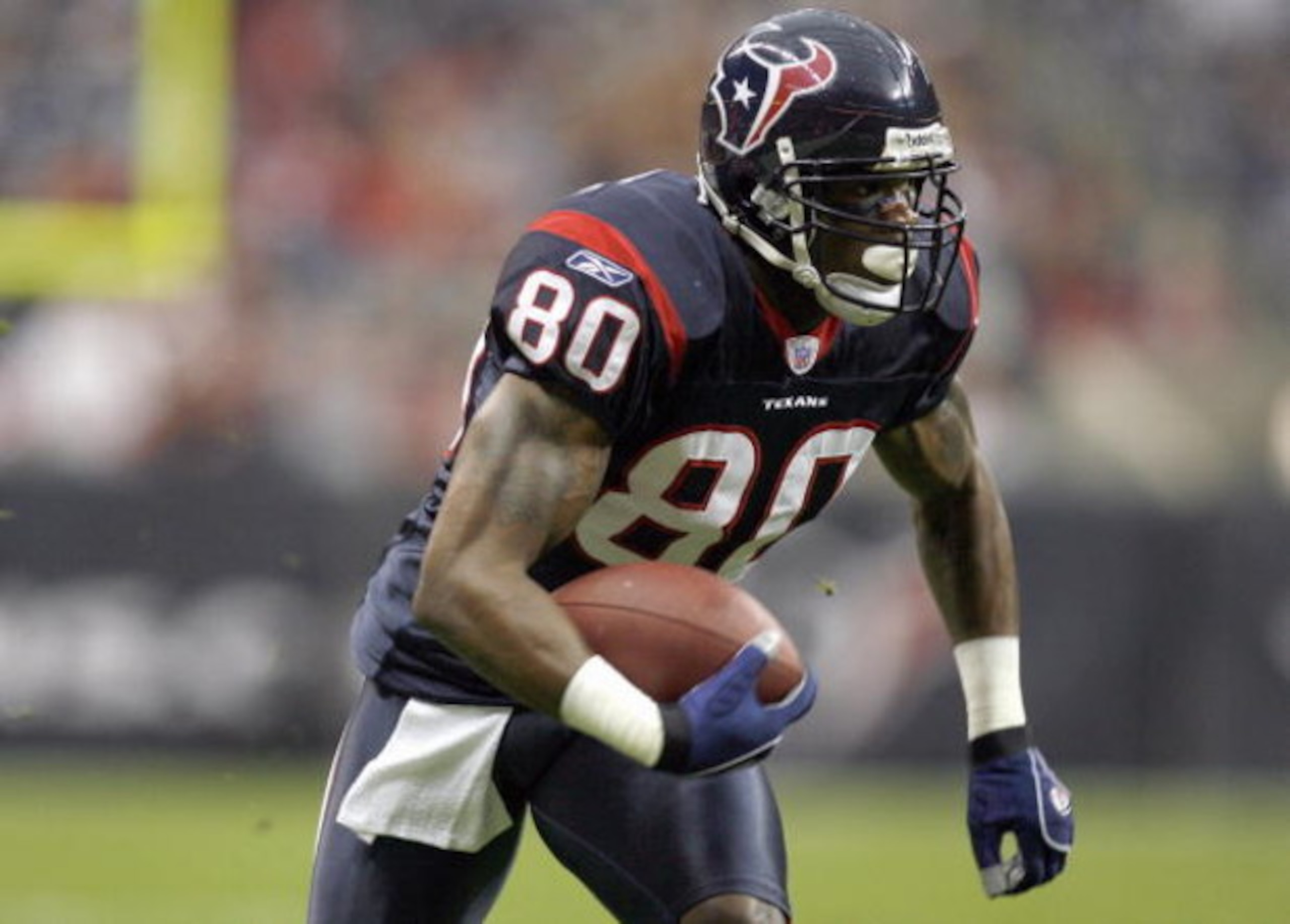 HOUSTON - DECEMBER 24:  Andre Johnson #80 of the Houston Texans carries the ball during the game against the Indianapolis Colts on December 24, 2006 at Reliant Stadium in Houston, Texas. The Texans defeated the Colts 27-24. (Photo by Chris Graythen/Getty 