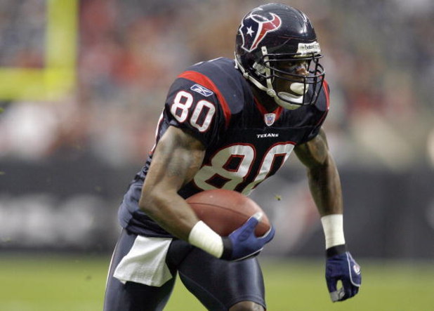 HOUSTON - DECEMBER 24:  Andre Johnson #80 of the Houston Texans carries the ball during the game against the Indianapolis Colts on December 24, 2006 at Reliant Stadium in Houston, Texas. The Texans defeated the Colts 27-24. (Photo by Chris Graythen/Getty 