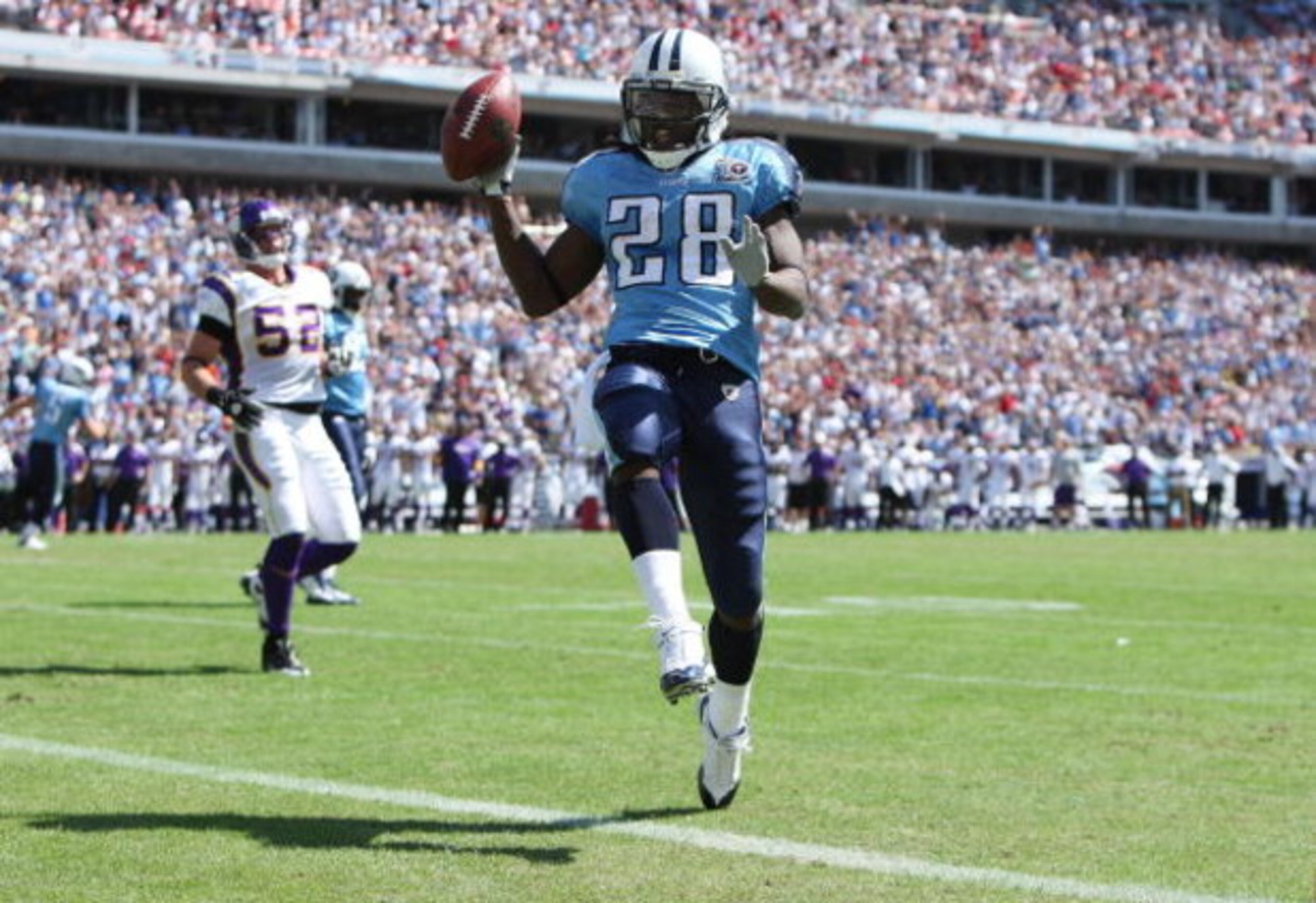 NASHVILLE, TN - SEPTEMBER 28:  Running back Chris Johnson #28 of the Tennessee Titans celebrates as he scores a touchdown against the Minnesota Vikings at LP Field on September 28, 2008 in Nashville, Tennessee.  (Photo by Doug Benc/Getty Images)