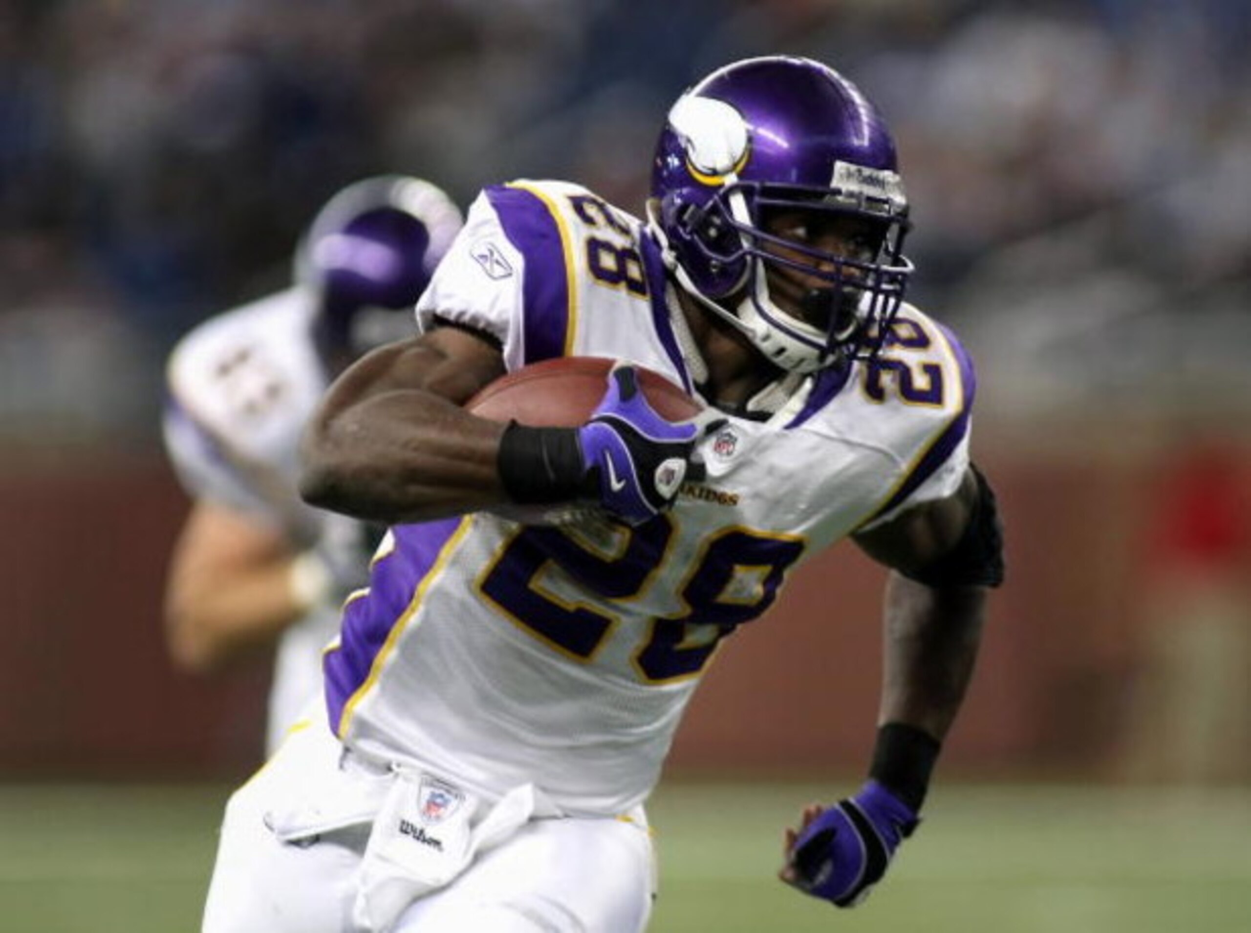 DETROIT - DECEMBER 07:  Running back Adrian Peterson #28 of the Minnesota Vikings rushes the ball for 22 yards during the third quarter of the NFL game against the Detroit Lions at Ford Field on December 7, 2008 in Detroit, Michigan. The Vikings defeated 