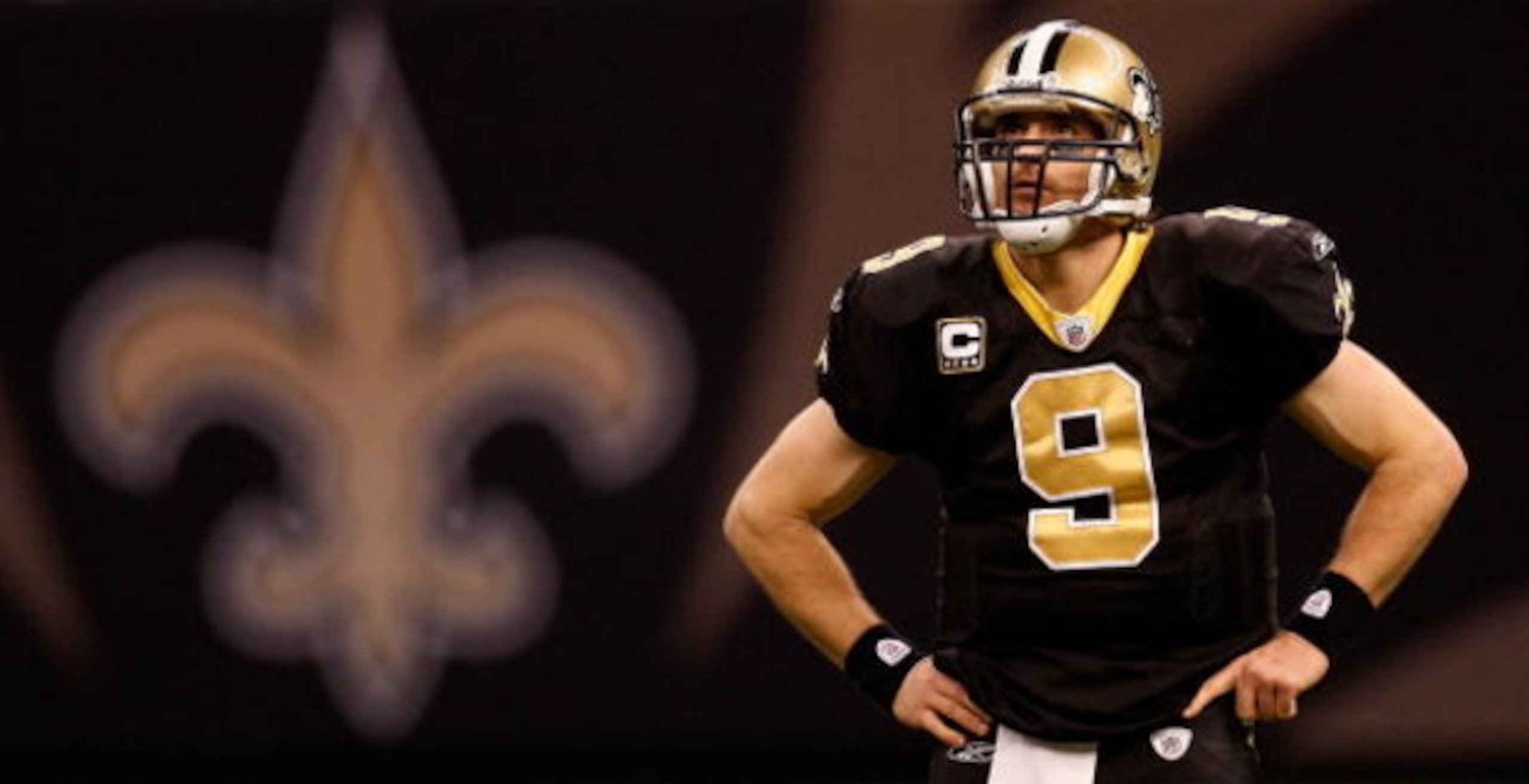 NEW ORLEANS - DECEMBER 28:  Quarterback Drew Brees #9 of the New Orleans Saints waits during a timeout against the Carolina Panthers 33-31 on December 28, 2008 at the Superdome in New Orleans, Louisiana.  (Photo by Chris Graythen/Getty Images)