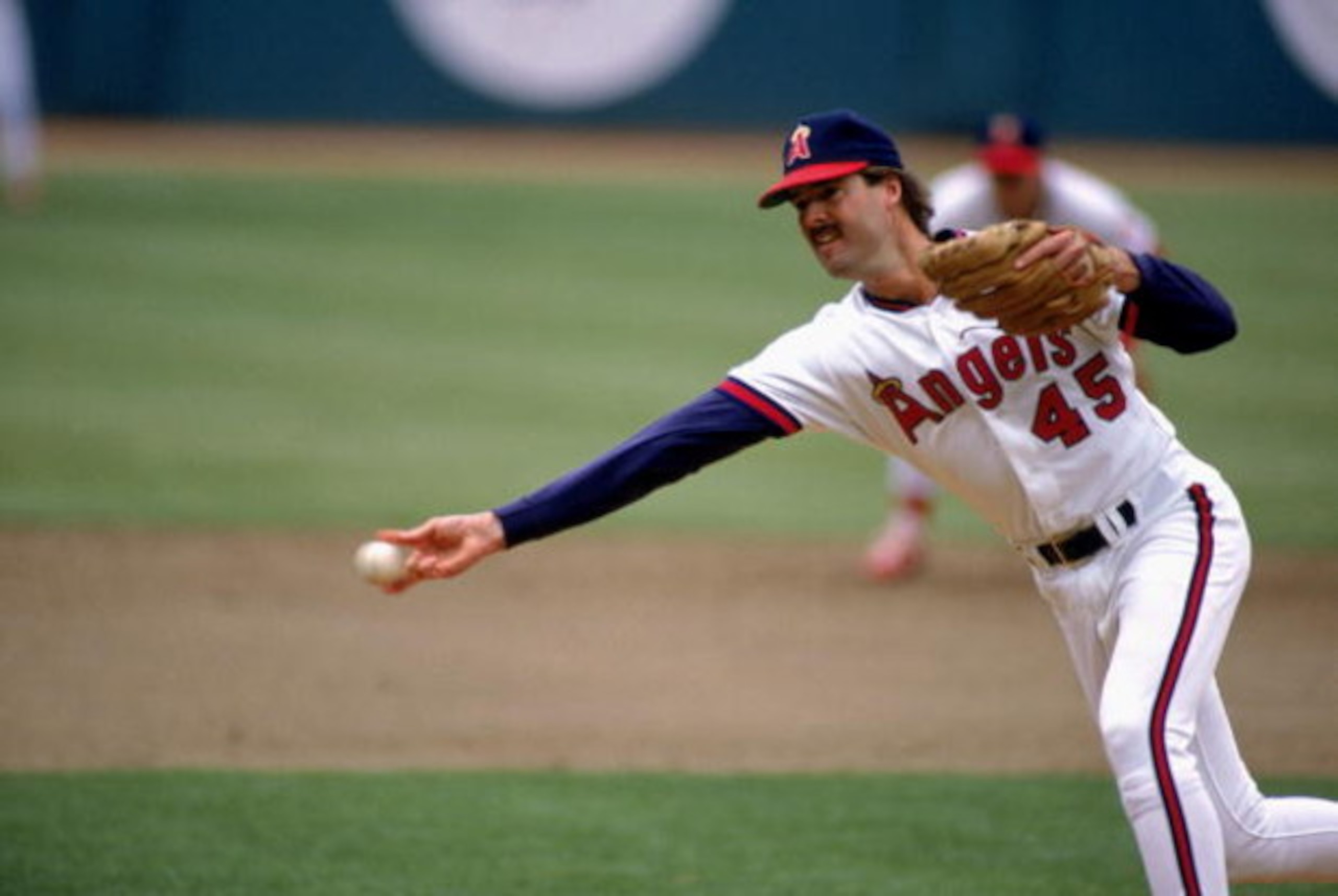 ANAHEIM - 1990:  Mark Eichhorn #45  of the California Angels throws the ball during their game at Anaheim Stadium in Anaheim, California.  (Photo by: Ken Levine/Getty Images)