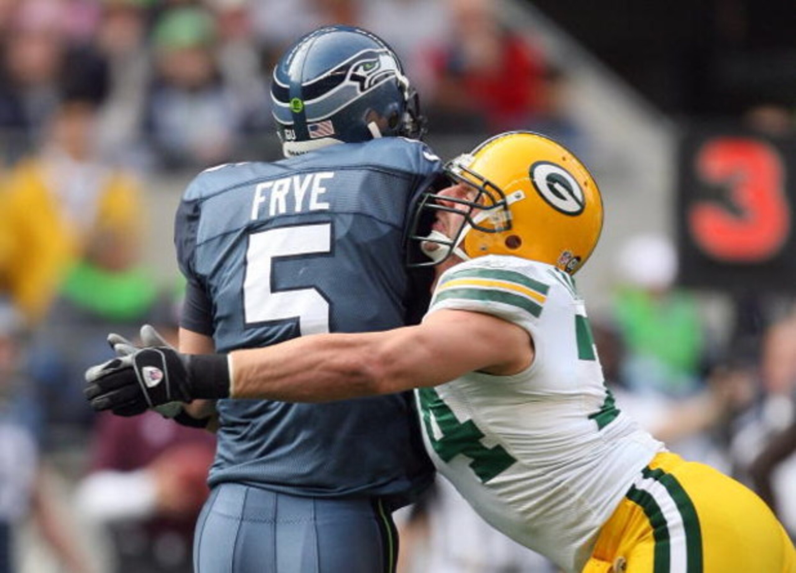 SEATTLE - OCTOBER 12:  Aaron Kampman #74 of the Green Bay Packers tackles quarterback Charlie Frye #5 of the Seattle Seahawks on October 12, 2008 at Qwest Field in Seattle, Washington. The Packers defeated the Seahawks 27-17. (Photo by Otto Greule Jr./Get