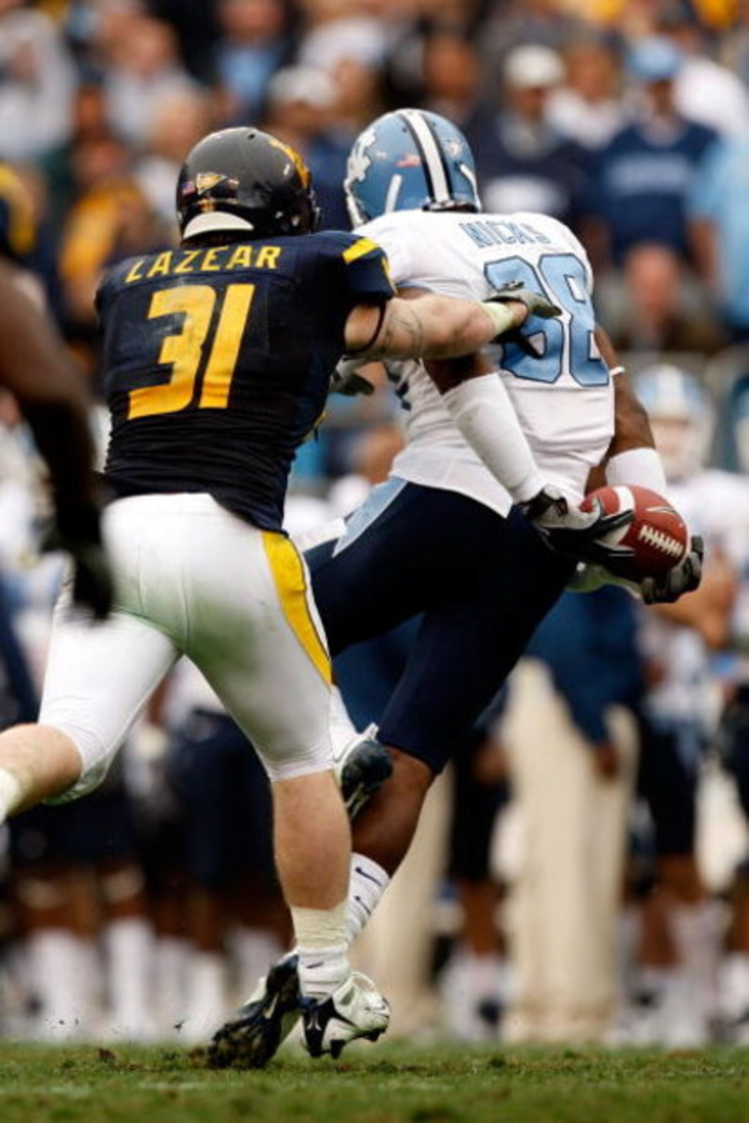 CHARLOTTE, NC - DECEMBER 27:  Hakeem Nicks #88 of the North Carolina Tar Heels catches a pass behind his back against  the West Virginia Mountaineers during the Meineke Car Care Bowl on December 27, 2008 at Bank of America Stadium in Charlotte, North Caro
