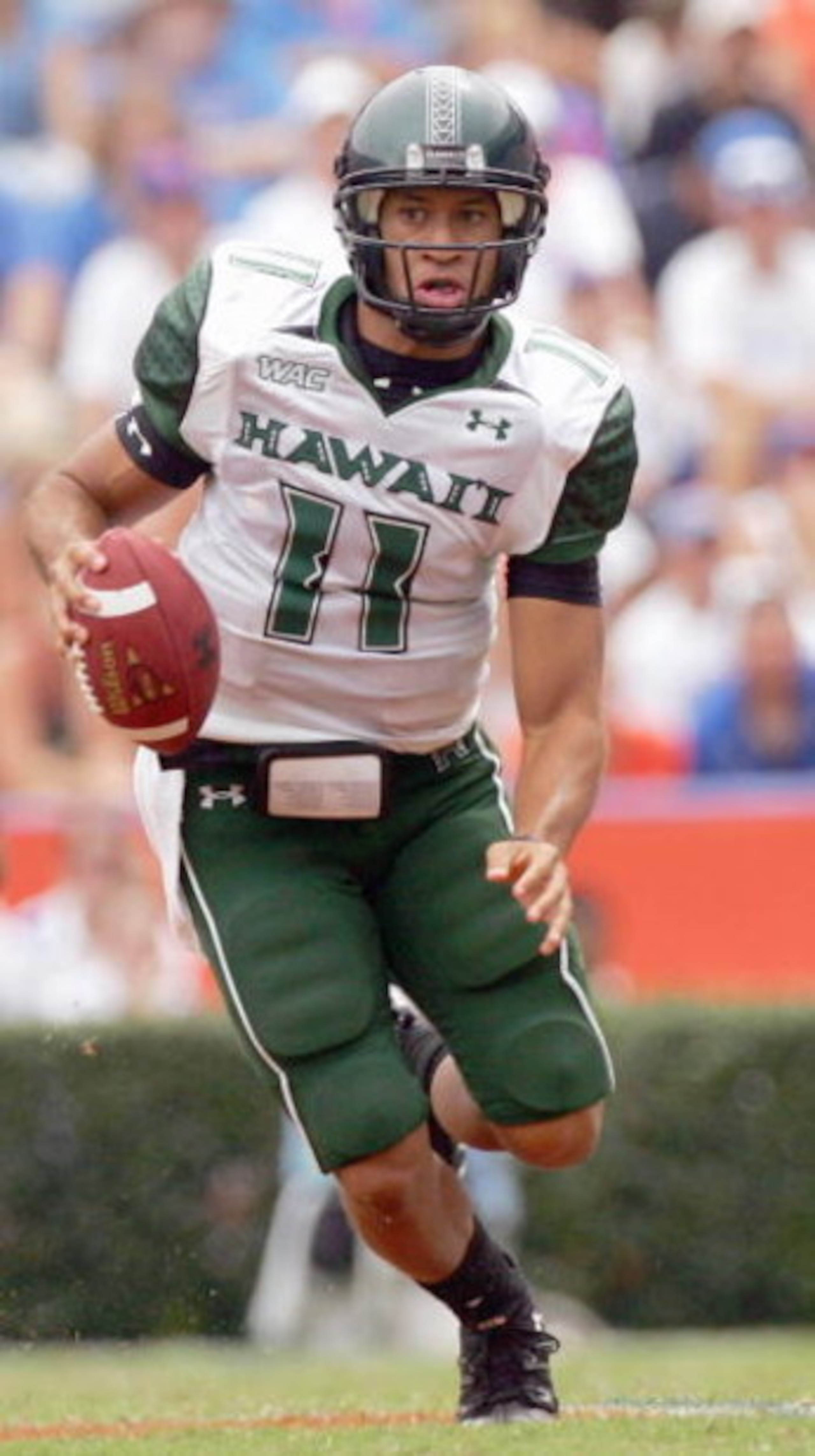 GAINESVILLE, FL - AUGUST 30:  Quarterback Kawika Funaki #11 of the Hawaii Warriors looks to pass the ball during the game against the Florida Gators at Ben Hill Griffin Stadium on August 30, 2008 in Gainesville, Florida.  (Photo by Sam Greenwood/Getty Ima