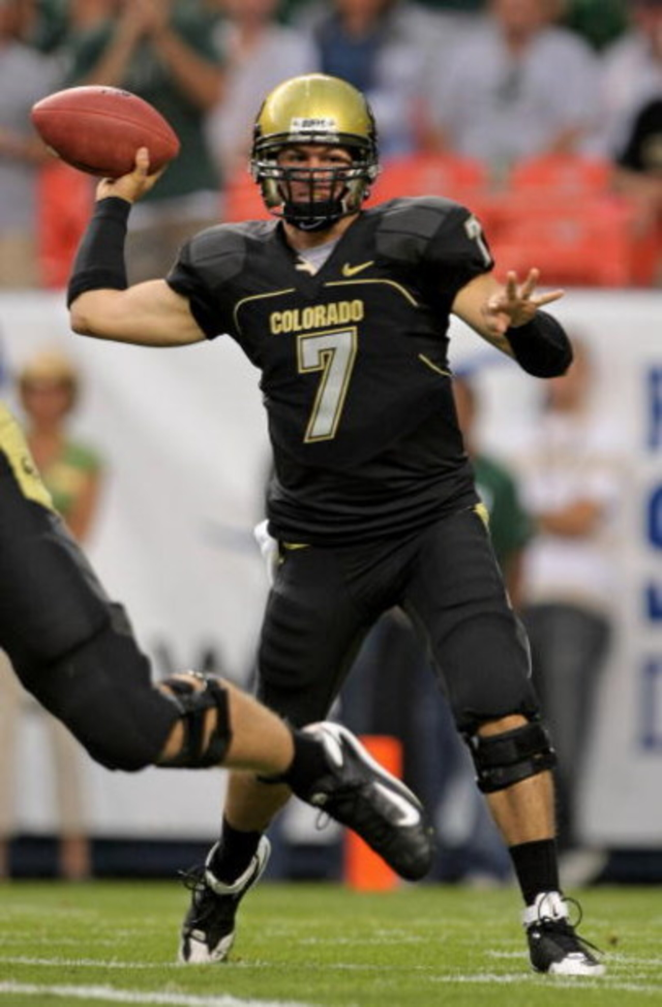 DENVER - AUGUST 31:  Quarterback Cody Hawkins #7 of the University of Colorado Buffaloes delivers a pass against the Colorado State University Rams at Invesco Field at Mile High on August 31, 2008 in Denver, Colorado. Colorado defeated Colorado State 38-1