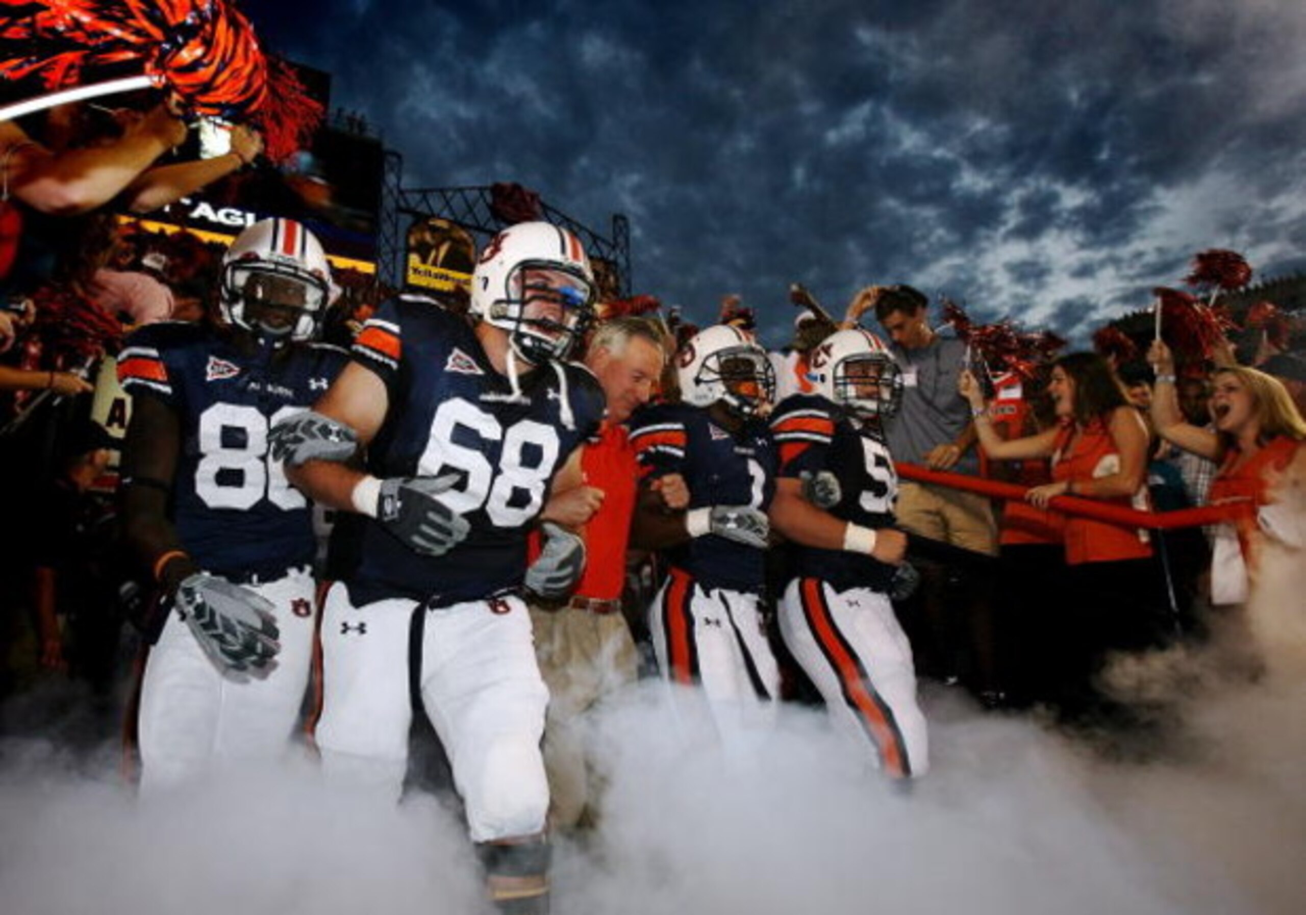 AUBURN, AL - SEPTEMBER 20: Offensive lineman Jason Bosley #68 of the Auburn Tigers leads head coach Tommy Tuberville and the rest of his team out of the tunnel before taking on the LSU Tigers missed a field goal at Jordan-Hare Stadium on September 20, 200