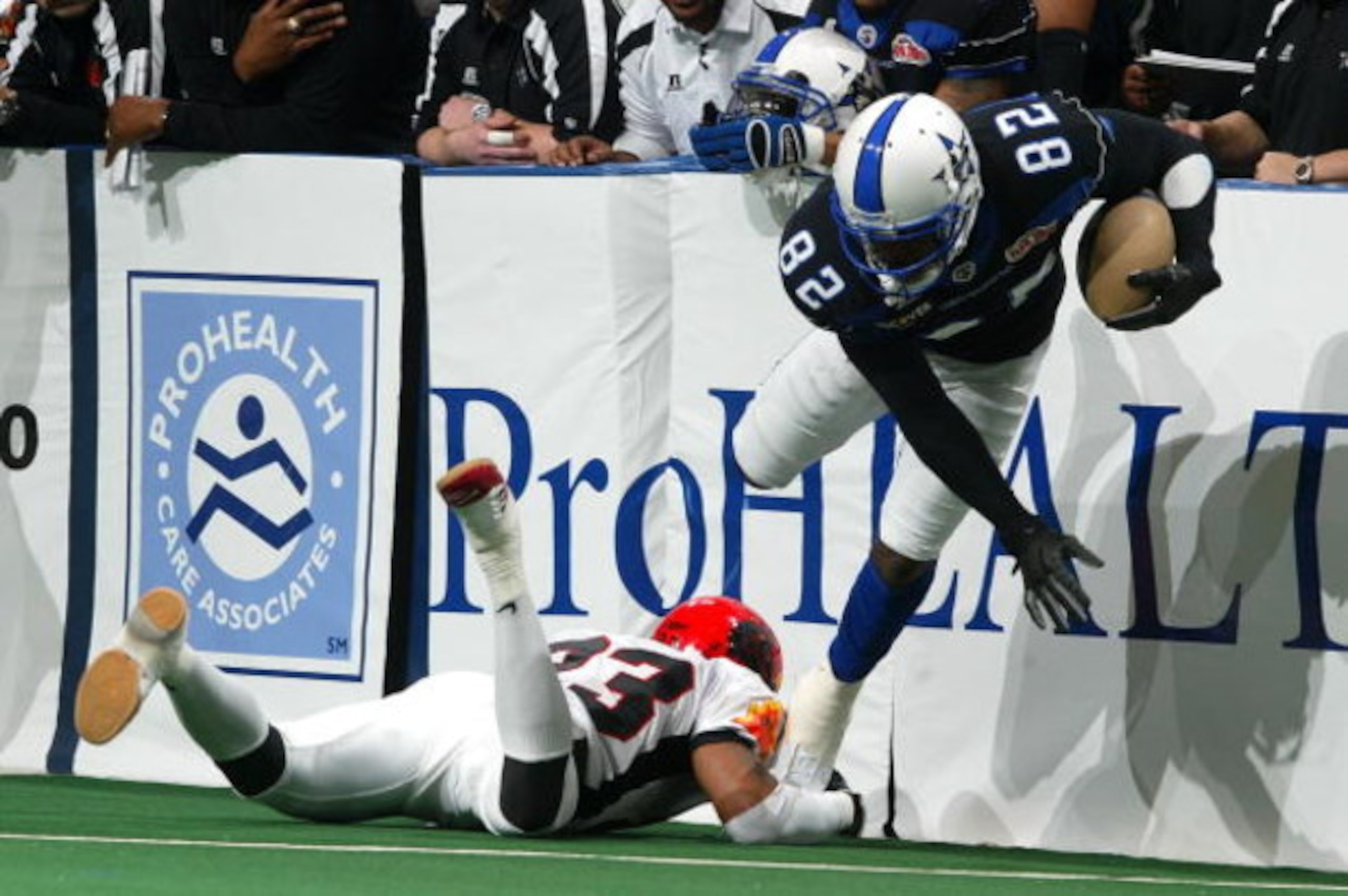 UNIONDALE, NY - MARCH 04:  Marcus Nash #82 of the Dallad Desperados eludes a tackle by Dahnel Singfield #23 of the New York Dragons during their Arena Football League game on March 4, 2007 at Nassau Coliseum in Uniondale, New York.  The Desperados defeate