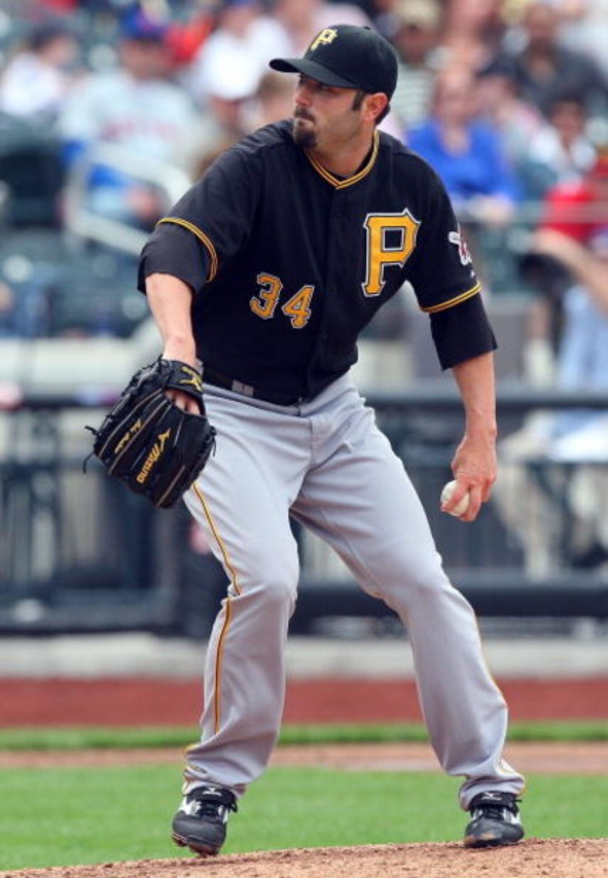 NEW YORK - MAY 09:  John Grabow #34 of the Pittsburgh Pirates pitches against the New York Mets on May 9, 2009 at Citi Field in the Flushing neighborhood of the Queens borough of New York City. The Mets defeated the Pirates 10-1.  (Photo by Jim McIsaac/Ge