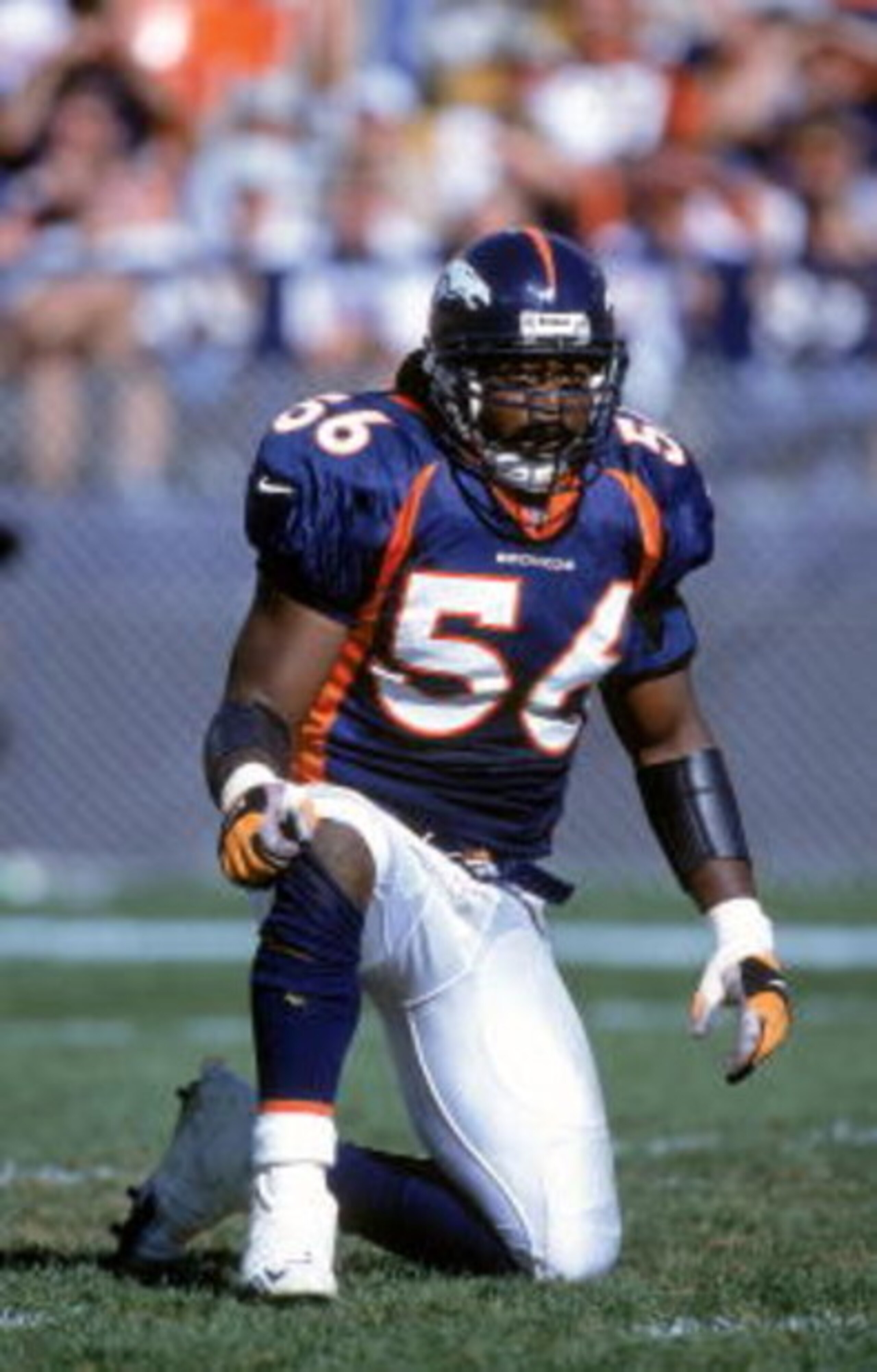 1 Oct 2000:  Al Wilson #56 of the Denver Bronocs kneels on the field during the game against the New England Patriots at the Mile High Stadium in Denver, Colorado. The Patriots defearted the Broncos 28-19..Mandatory Credit: Brian Bahr  /Allsport
