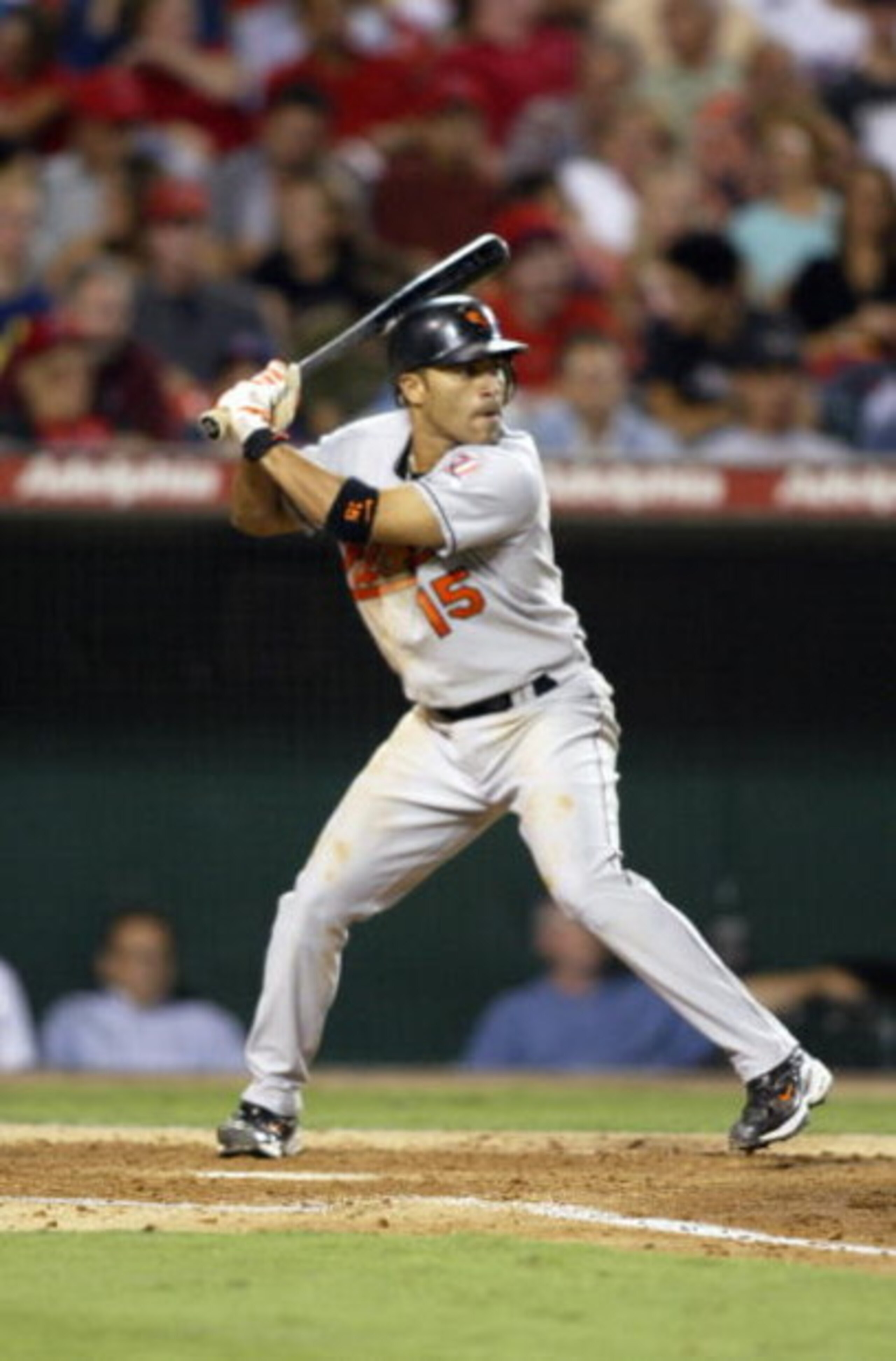 ANAHEIM, CA - AUGUST 11:  Infielder Jerry Hairston Jr. #15 of the Baltimore Orioles swings at an Anaheim Angels pitch during the game at Angel Stadium of Anaheim on August 11, 2004 in Anaheim, California. The Angels won 4-2. (Photo by Streeter Lecka/Getty