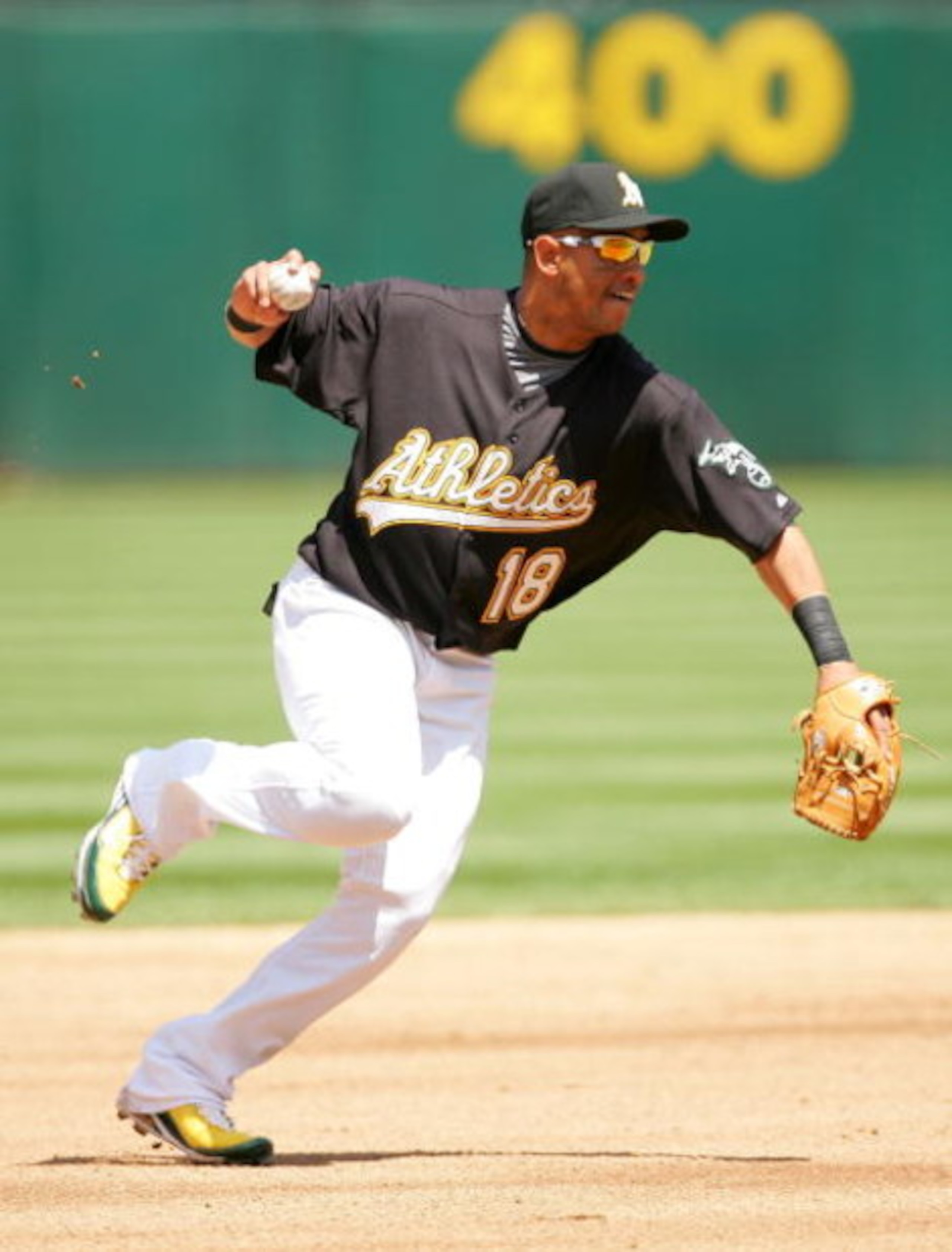 OAKLAND, CA - MAY 09:  Orlando Cabrera #18  of the Oakland Athletics throws to first base during their against the Toronto Blue Jays on May 9, 2009 at the Oakland Coliseum in Oakland, California.  (Photo by Ezra Shaw/Getty Images)