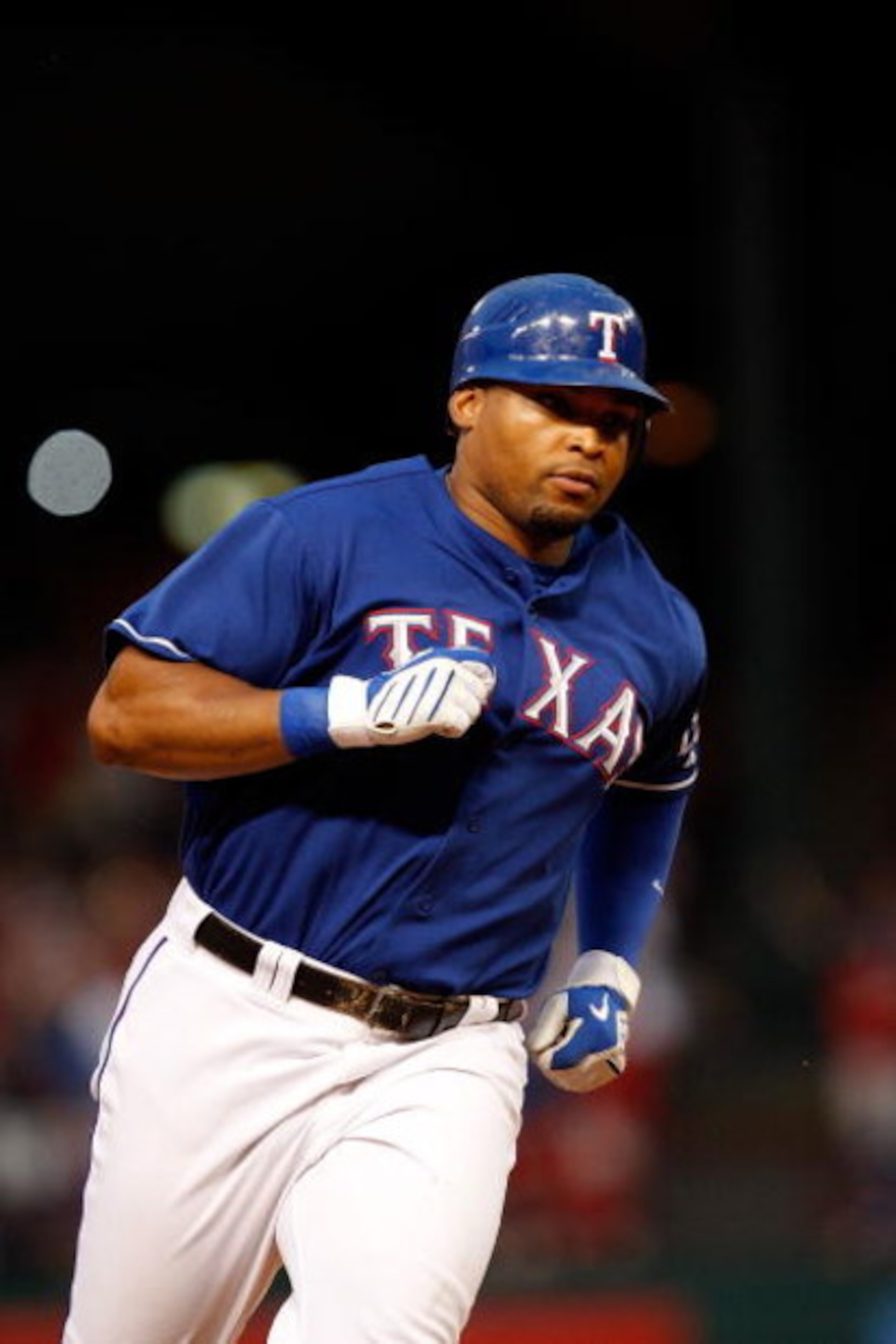 ARLINGTON, TX - JULY 31:  Marlon Byrd #22 of the Texas Rangers runs the bases after hitting a three-run home run against the Seattle Mariners on July 31, 2009 at Rangers Ballpark in Arlington, Texas.  (Photo by Ronald Martinez/Getty Images)