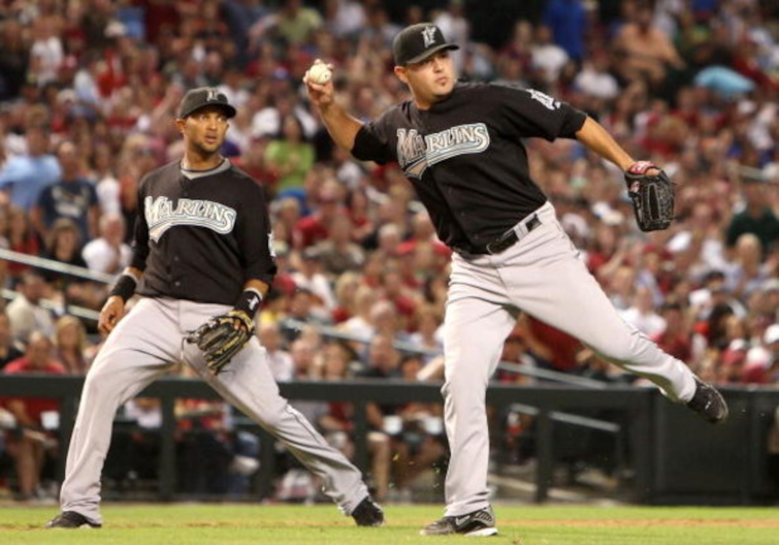 PHOENIX - JULY 10:  Starting pitcher Ricky Nolasco #47 of the Florida Marlins attempts to field an RBI single hit by Dan Haren #15 (not pictured) of the Arizona Diamondbacks during the fourth inning of the major league baseball game at Chase Field on July