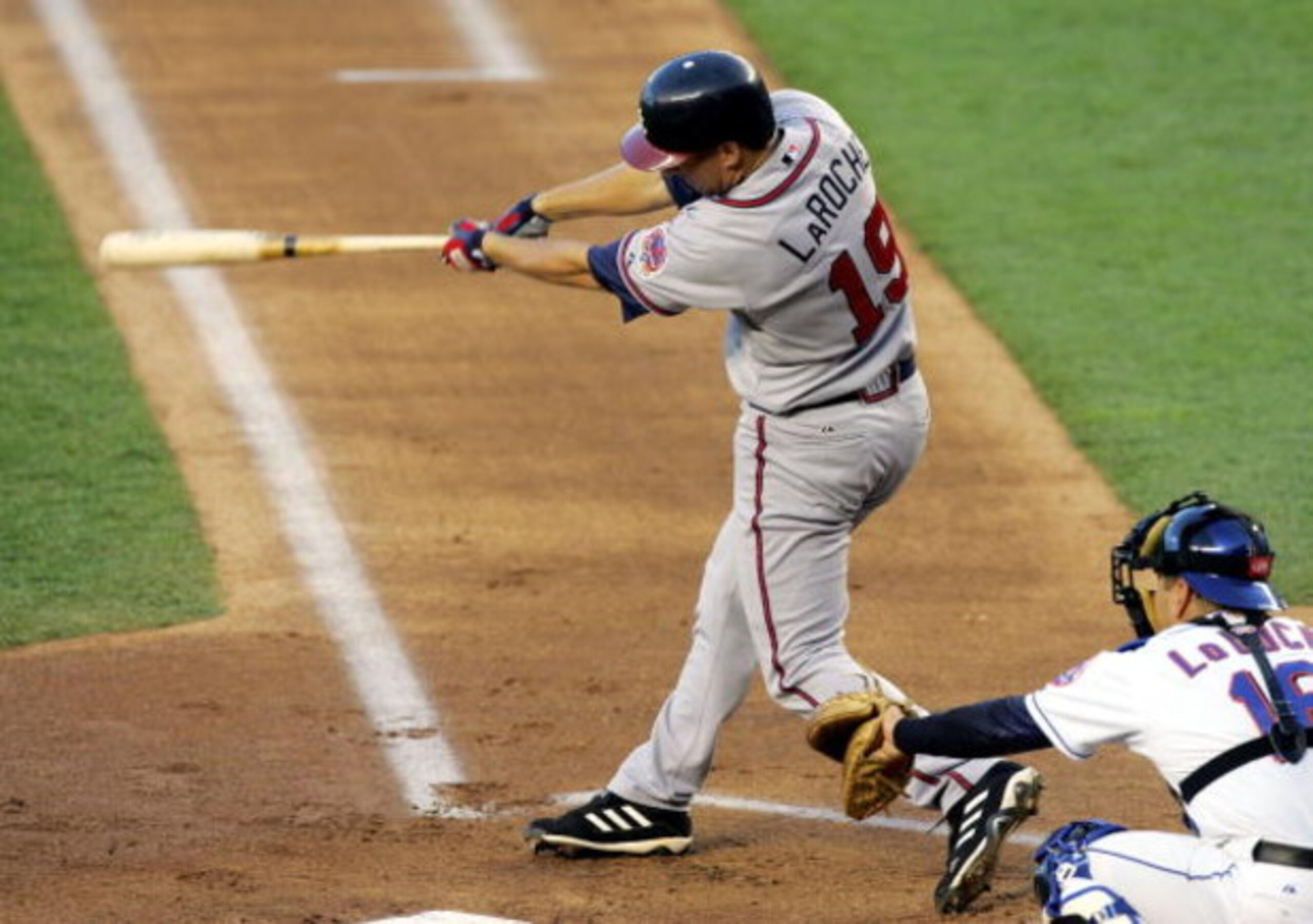 NEW YORK - APRIL 18:  Adam LaRoche #19 of the Atlanta Braves hits a two run double against the New York Mets in the first inning on April 18, 2006 at Shea Stadium in the Flushing neighborhood of the Queens borough of New York City.  (Photo by Jim McIsaac/
