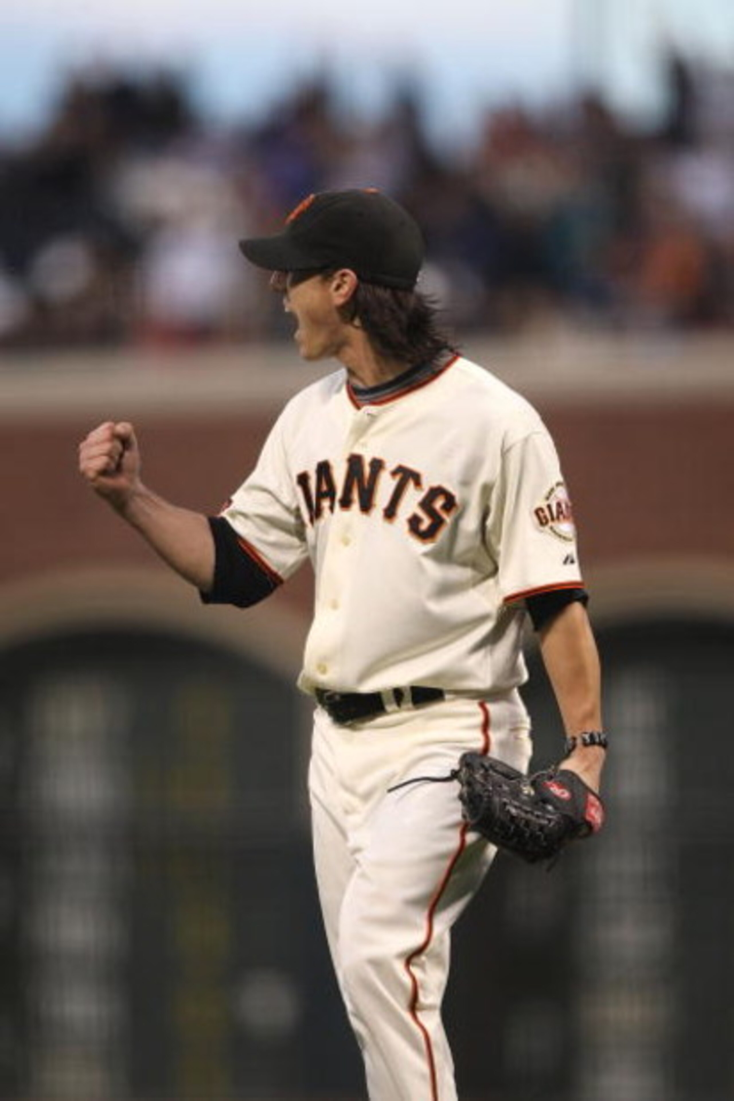 SAN FRANCISCO - AUGUST 01:  Tim Lincecum #55 of the San Francisco Giants reacts after getting the last out in the 8th inning against the Philadelphia Phillies during a Major League Baseball game at AT&T Park on August 1, 2009 in San Francisco, California.