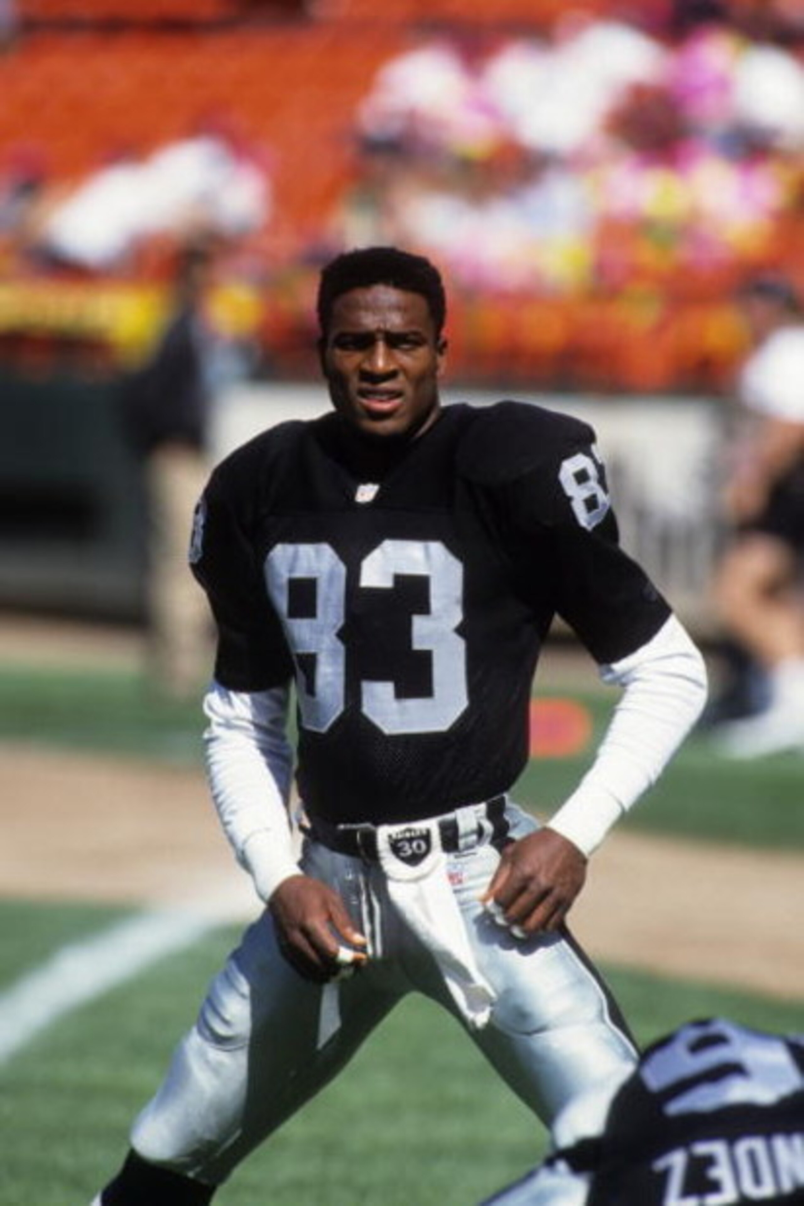 SAN FRANCISCO - AUGUST 8:  Wide receiver Willie Gault #83 of the Los Angeles Raiders stretches on the field prior to a preseason game against the San Francisco 49ers at Candlestick Park on August 8, 1992 in San Francisco, California. The 49ers won 24-10. 