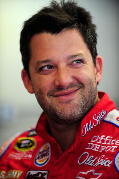INDIANAPOLIS - JULY 24:  Tony Stewart, driver of the #14 Old Spice/Office Depot Chevrolet, looks on during practice for the NASCAR Sprint Cup Series Allstate 400 at the Brickyard at Indianapolis Motor Speedway on July 24, 2009 in Indianapolis, Indiana.  (