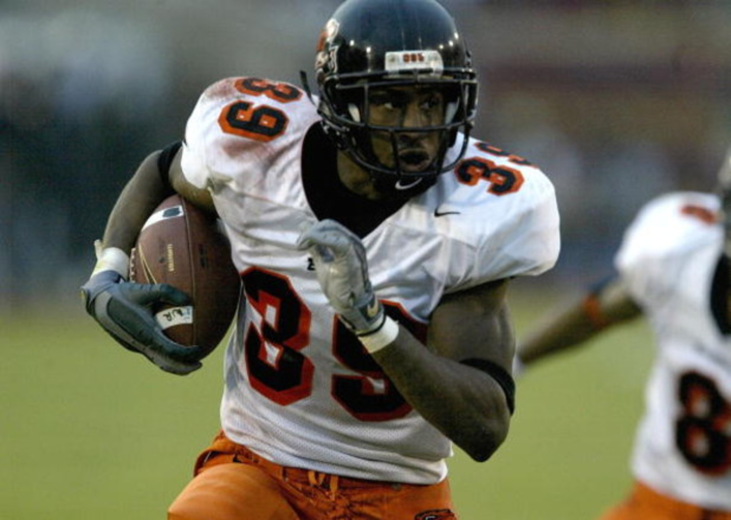 LOS ANGELES - DECEMBER 6:  Defensive back Brandon Browner #39 of the Oregon State Beavers returns an interception for a touchdown against the USC Trojans on December 6, 2003 at the Los Angeles Coliseum in Los Angeles, California.  USC won 52-28.  (Photo b