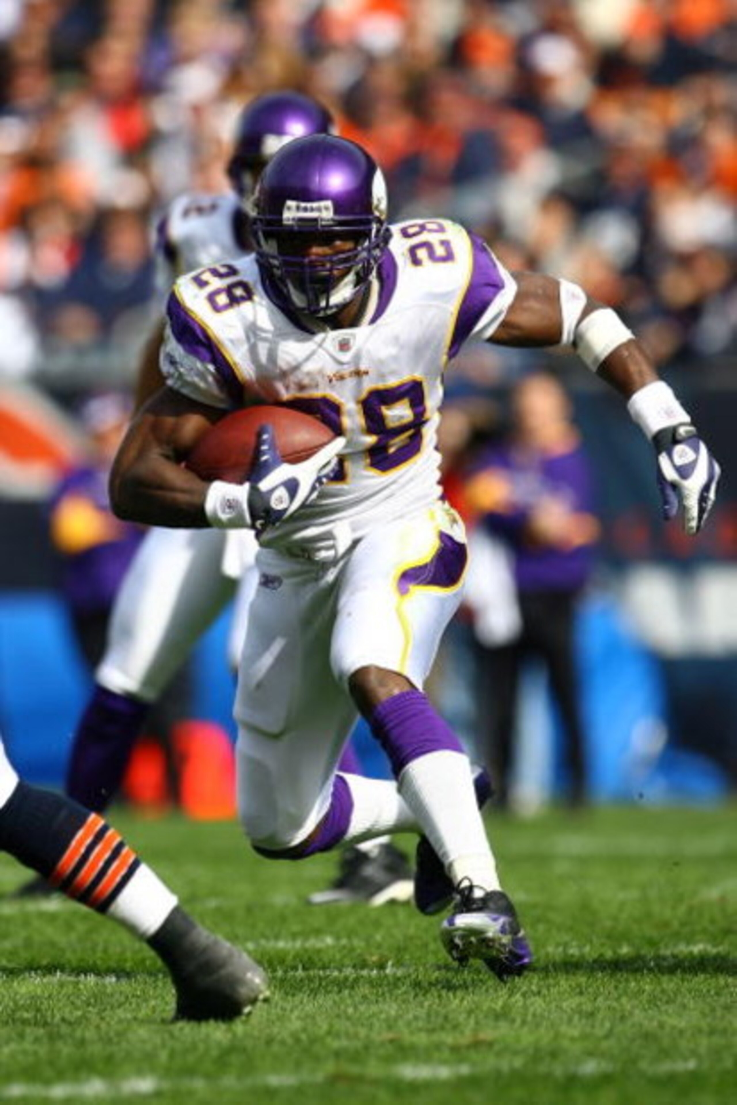 CHICAGO - OCTOBER 19:  Adrian Peterson #28 of the Minnesota Vikings runs the ball against the Chicago Bears at Soldier Field on October 19, 2008 in Chicago, Illinois.  (Photo by Jeff Gross/Getty Images)