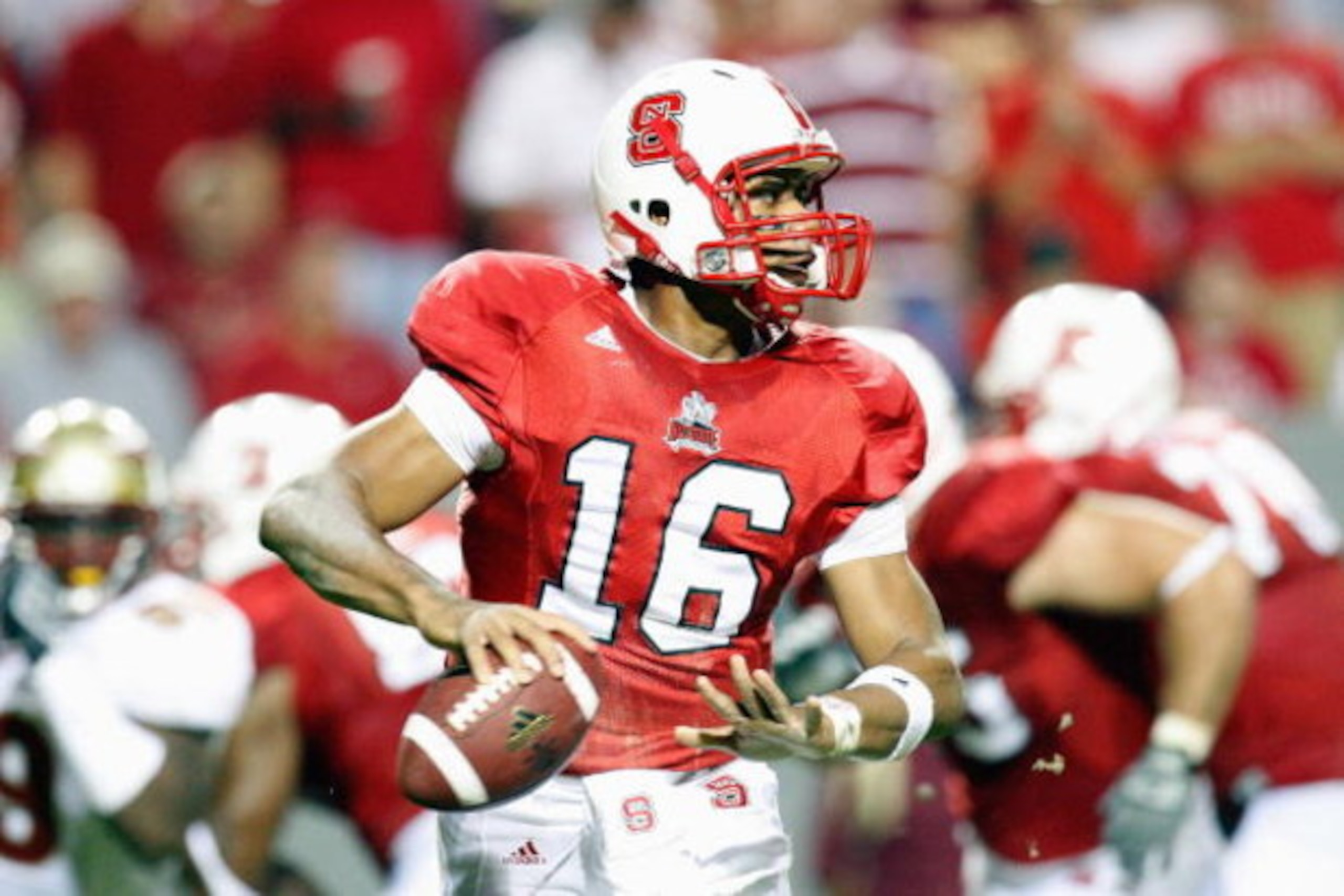 RALEIGH, NC - OCTOBER 16:  Russell Wilson #16 of the North Carolina State Wolfpack looks for a receiver during the game against the Florida State Seminoles at Carter-Finley Stadium on October 16, 2008 in Raleigh, North Carolina.  (Photo by Kevin C. Cox/Ge