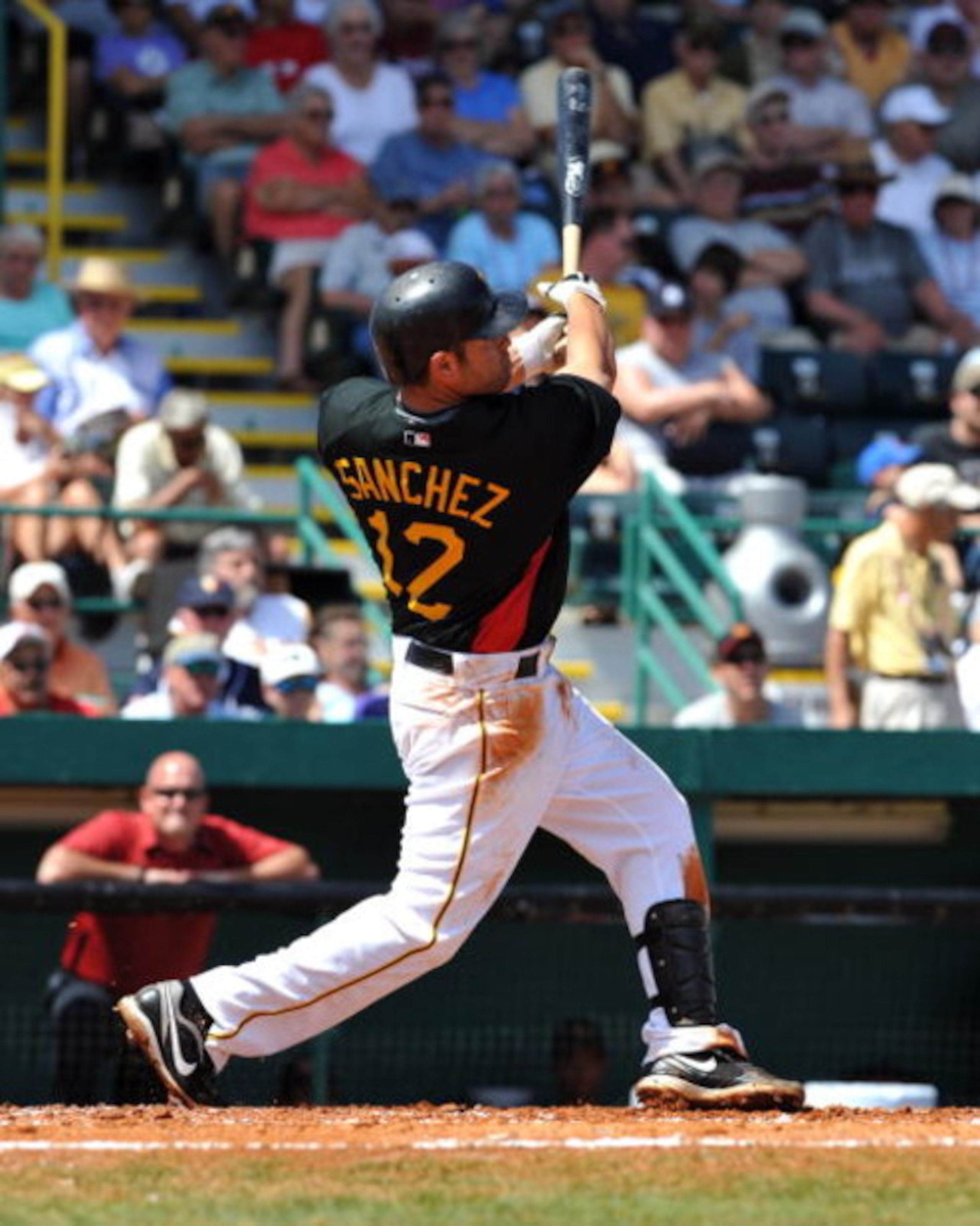 BRADENTON, FL - MARCH 8:  Infielder Freddy Sanchez #12 of the Pittsburgh Pirates hits a home run against the Houston Astros March 8, 2009 at McKechnie Field in Bradenton, Florida.  (Photo by Al Messerschmidt/Getty Images)