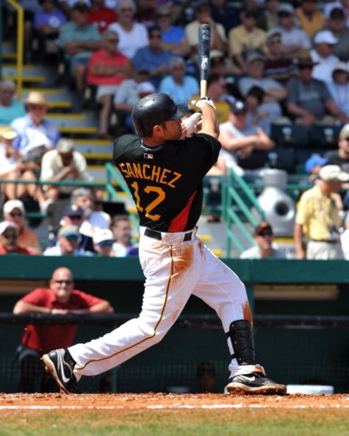 BRADENTON, FL - MARCH 8:  Infielder Freddy Sanchez #12 of the Pittsburgh Pirates hits a home run against the Houston Astros March 8, 2009 at McKechnie Field in Bradenton, Florida.  (Photo by Al Messerschmidt/Getty Images)