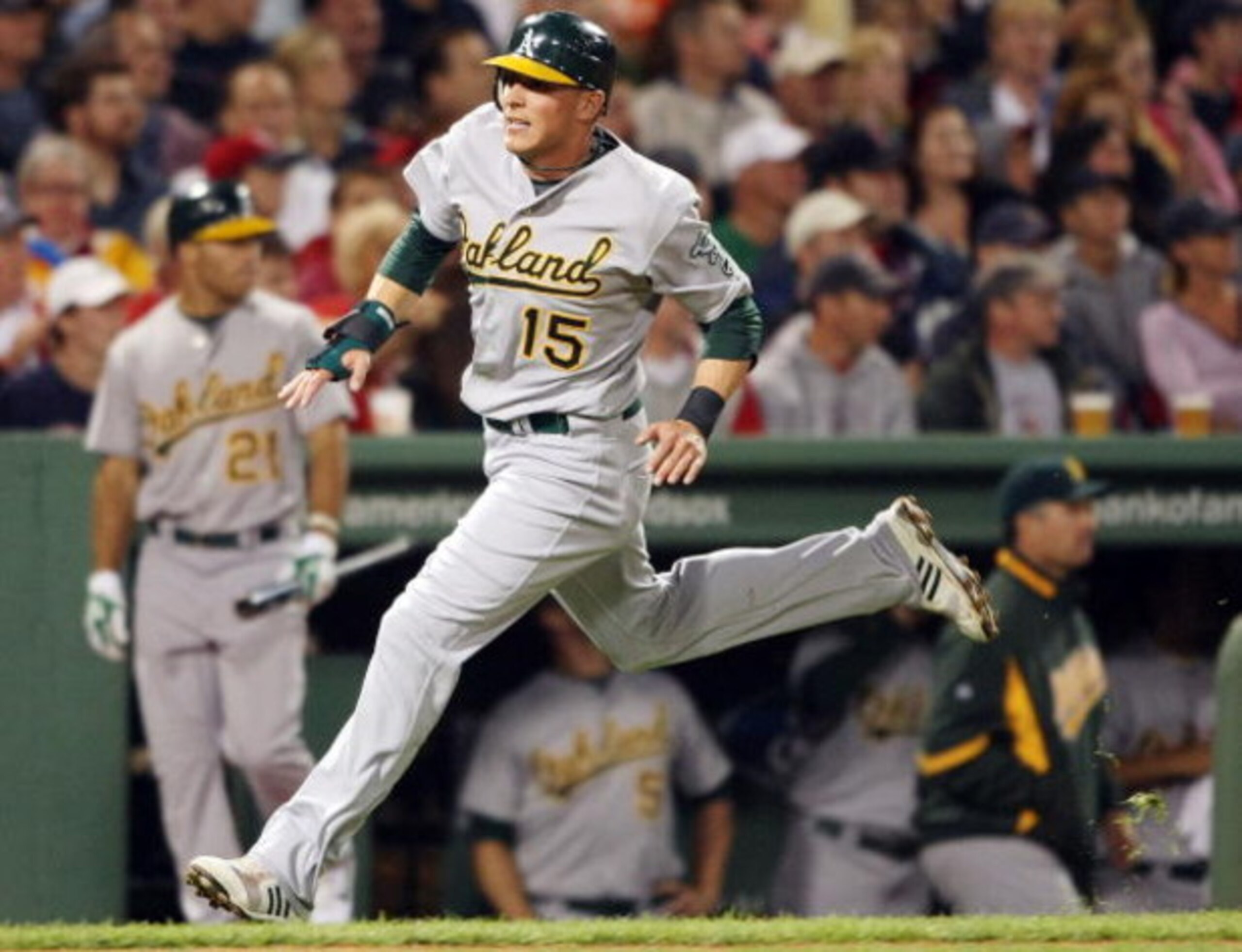 BOSTON - JULY 07:  Ryan Sweeney #15 of the Oakland Athletics scores a run in the fifth inning against the Boston Red Sox on July 7, 2009 at Fenway Park in Boston, Massachusetts.  (Photo by Elsa/Getty Images)