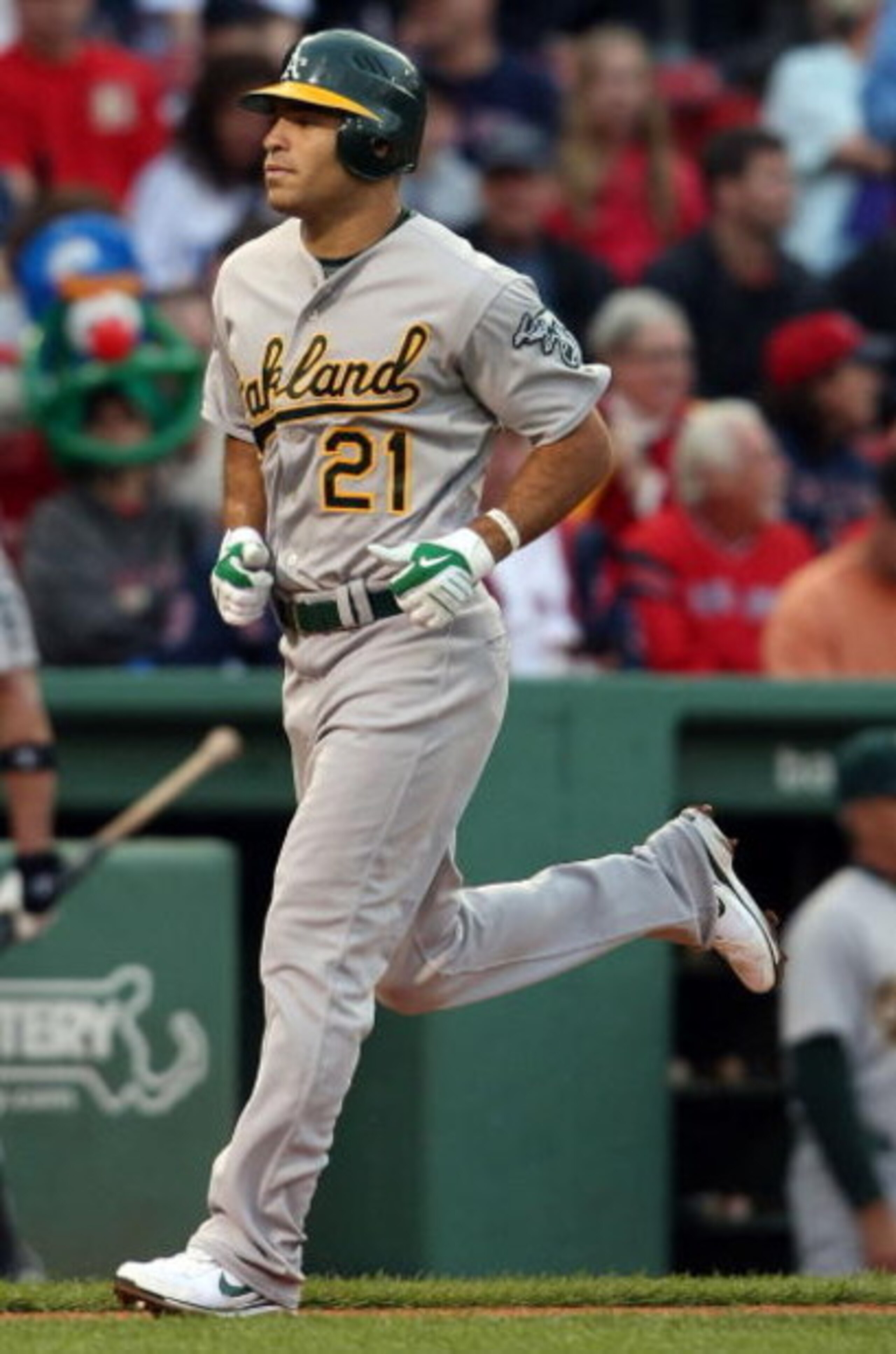 BOSTON - JULY 07:  Scott Hairston #21 of the Oakland Athletics heads for home plate after his solo home run in the first inning off a pitch by Josh Beckett of the Boston Red Sox non July 7, 2009 at Fenway Park in Boston, Massachusetts.  (Photo by Elsa/Get