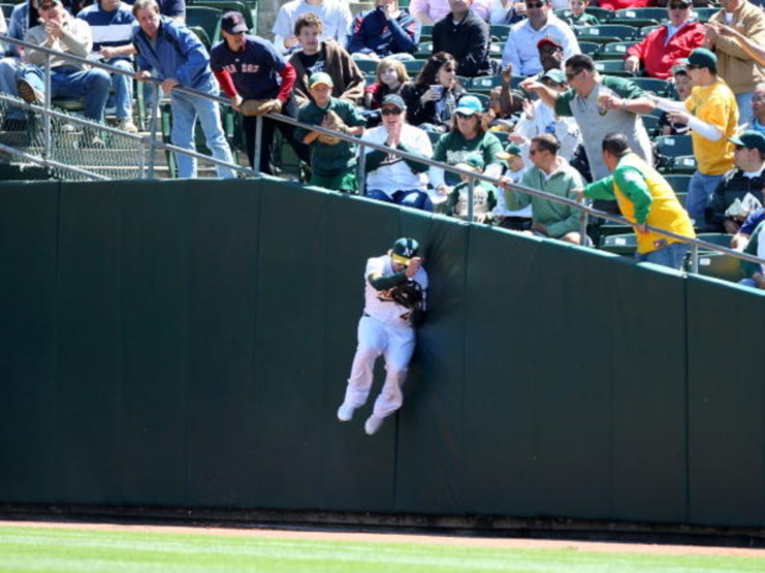 OAKLAND, CA - APRIL 15: Travis Buck #6 of the Oakland Athletics catches a ball hit by Nick Green #22 of the Boston Red Sox during a Major League Baseball game at the Oakland Coliseum April 15, 2009 in Oakland, California. All Major League Baseball players
