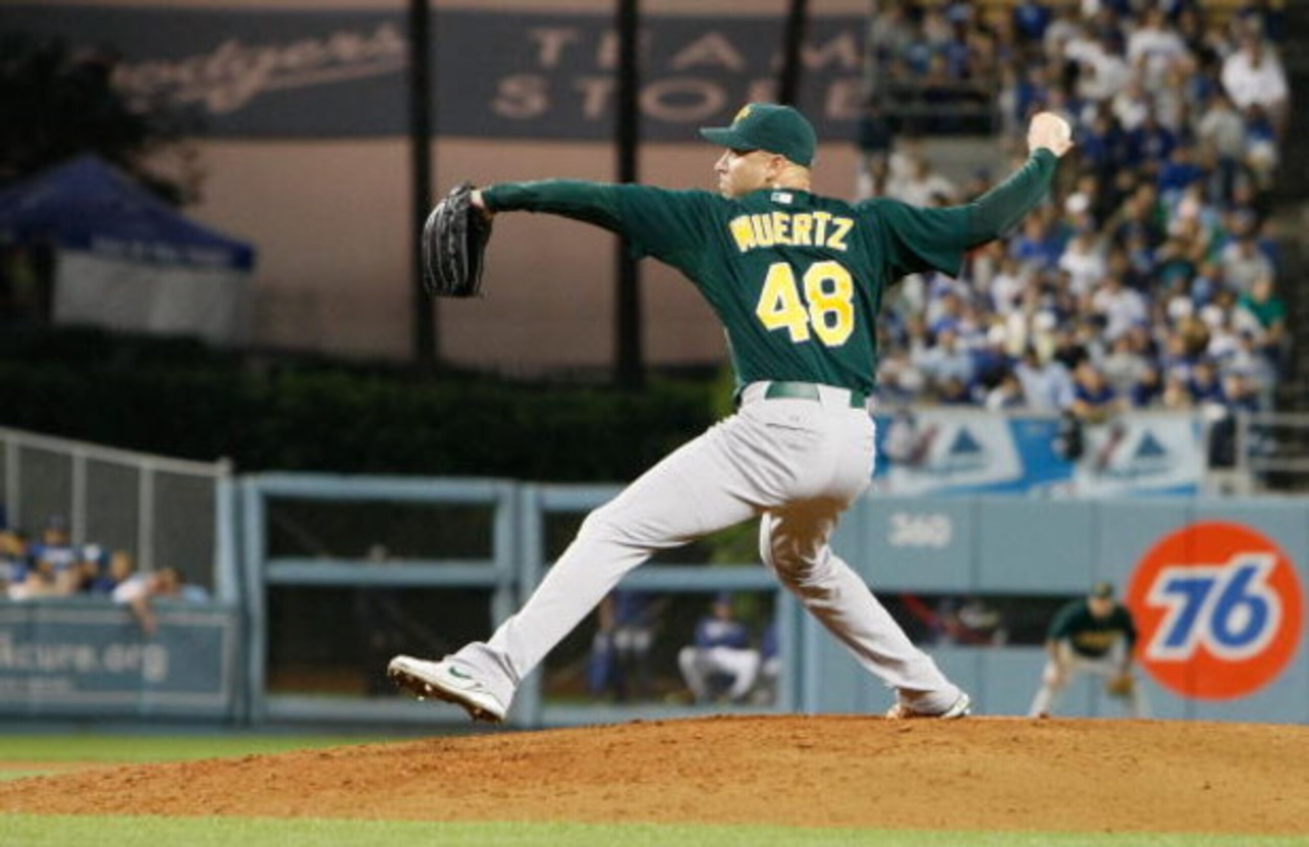 LOS ANGELES, CA - JUNE 16:  Michael Wuertz #48 of the Oakland Athletics pitches against the Los Angeles Dodgers at Dodger Stadium on June 16, 2009 in Los Angeles, California.  (Photo by Jeff Gross/Getty Images)