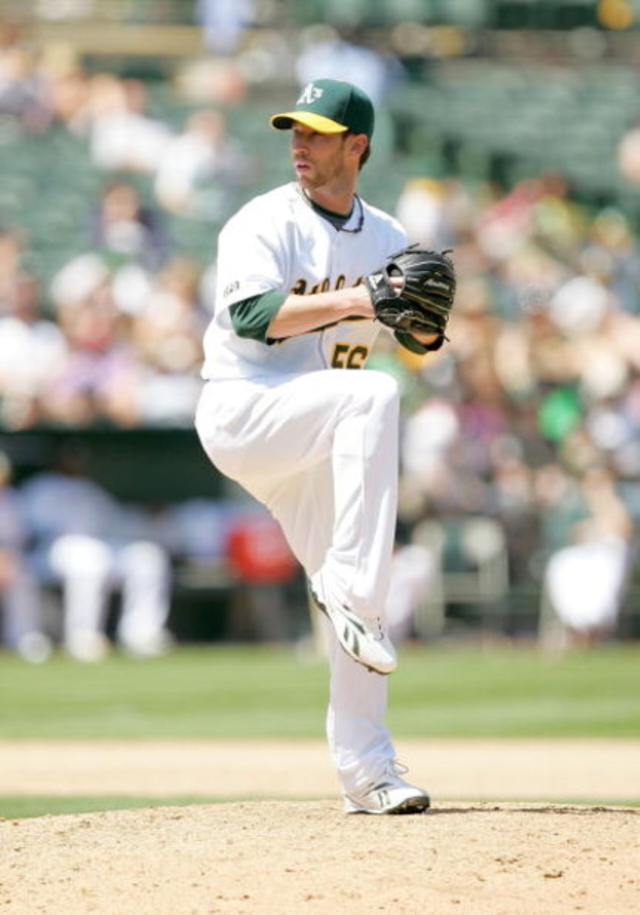 OAKLAND, CA - MAY 27:  Craig Breslow #56 of the Oakland Athletics pitches to the Seattle Mariners at the Oakland Coliseum on May 27, 2009 in Oakland, California.  (Photo by Ezra Shaw/Getty Images)